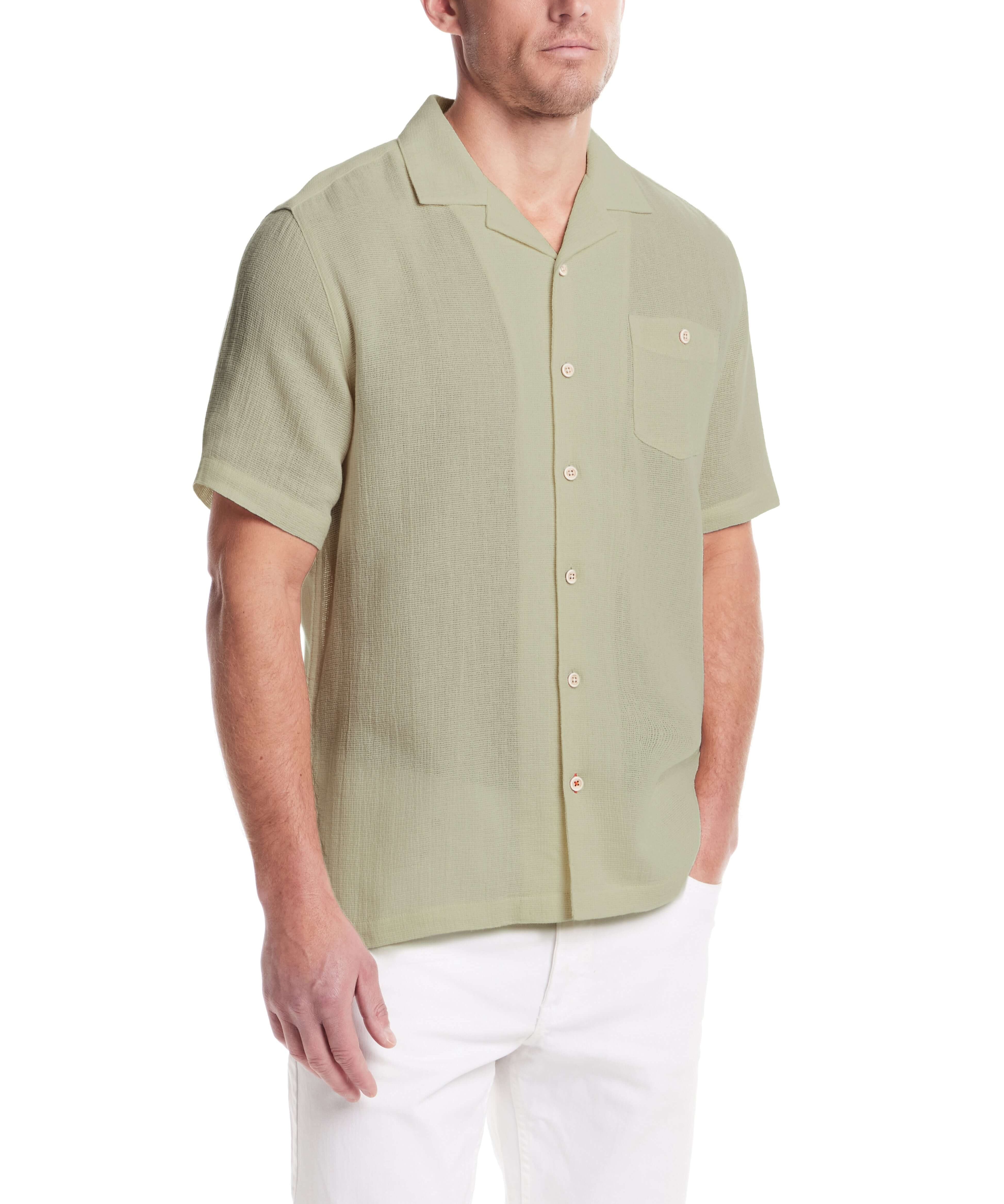 Short Sleeve Cotton Linen Airtex Shirt in Sea Grass worn by a model, featuring a camp collar and button-down chest pocket.