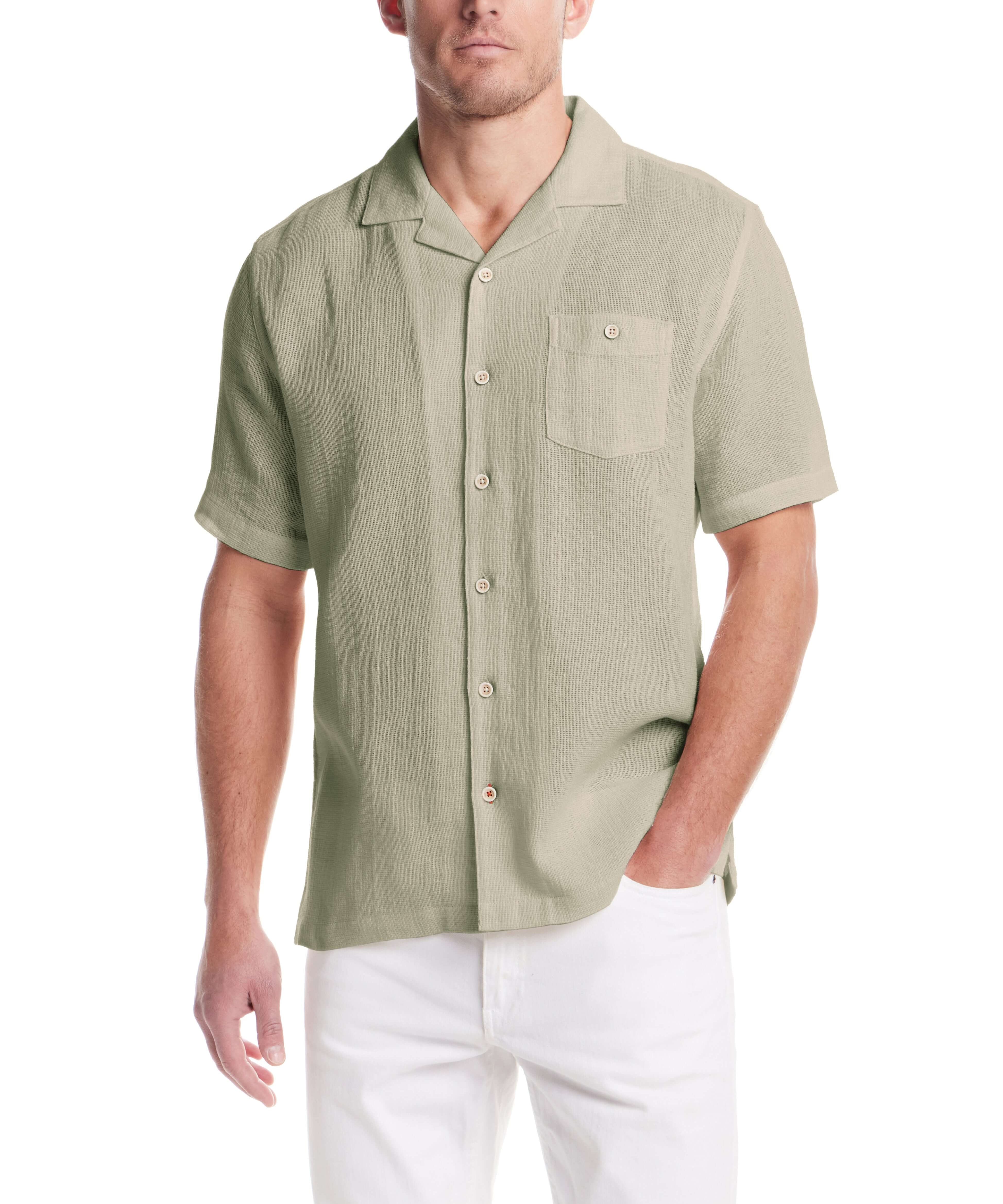 Short Sleeve Cotton Linen Airtex Shirt in Sea Grass worn by a model, showcasing its camp collar and button down pocket.