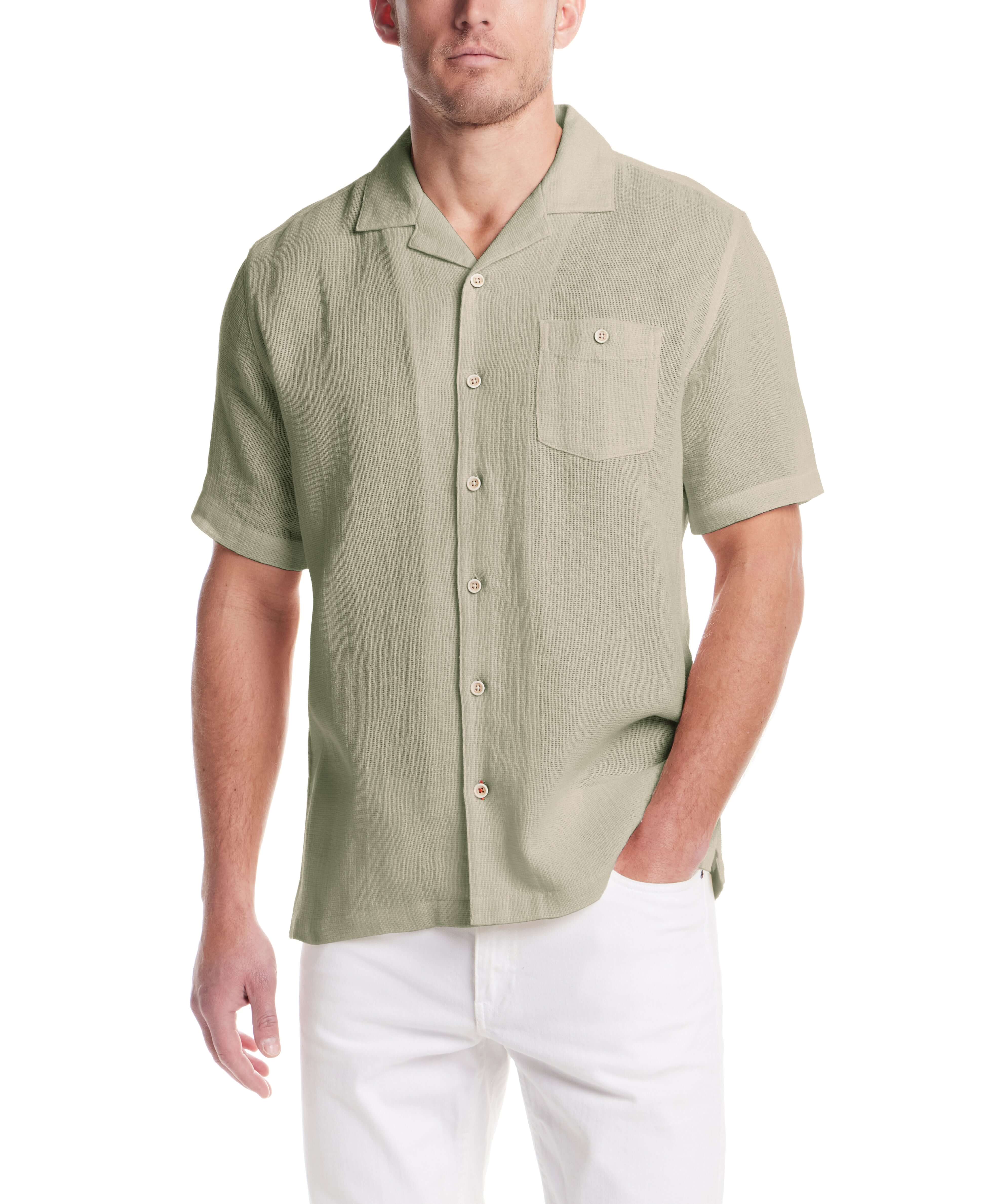Short Sleeve Cotton Linen Airtex Shirt in Sea Grass worn by a model, showcasing its camp collar and button down pocket.