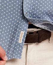 Close-up of Double Layer Dobby Short Sleeve Shirt in Dusty Blue, showcasing textured fabric and label detail.