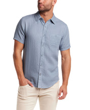 Double Layer Dobby Short Sleeve Shirt in Dusty Blue worn by male model, featuring a textured pattern and button chest pocket.