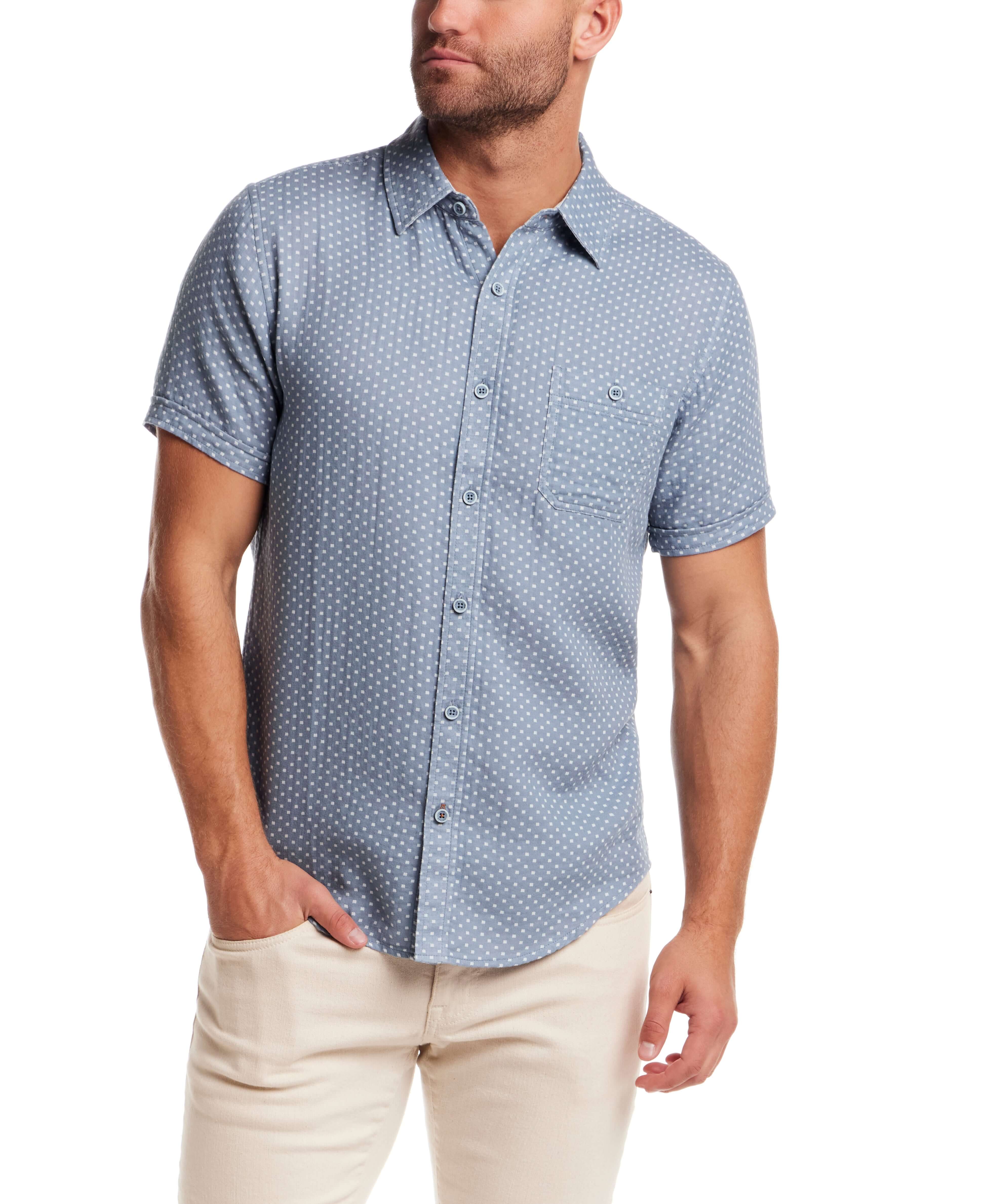 Double Layer Dobby Short Sleeve Shirt in Dusty Blue worn by male model, featuring a textured pattern and button chest pocket.