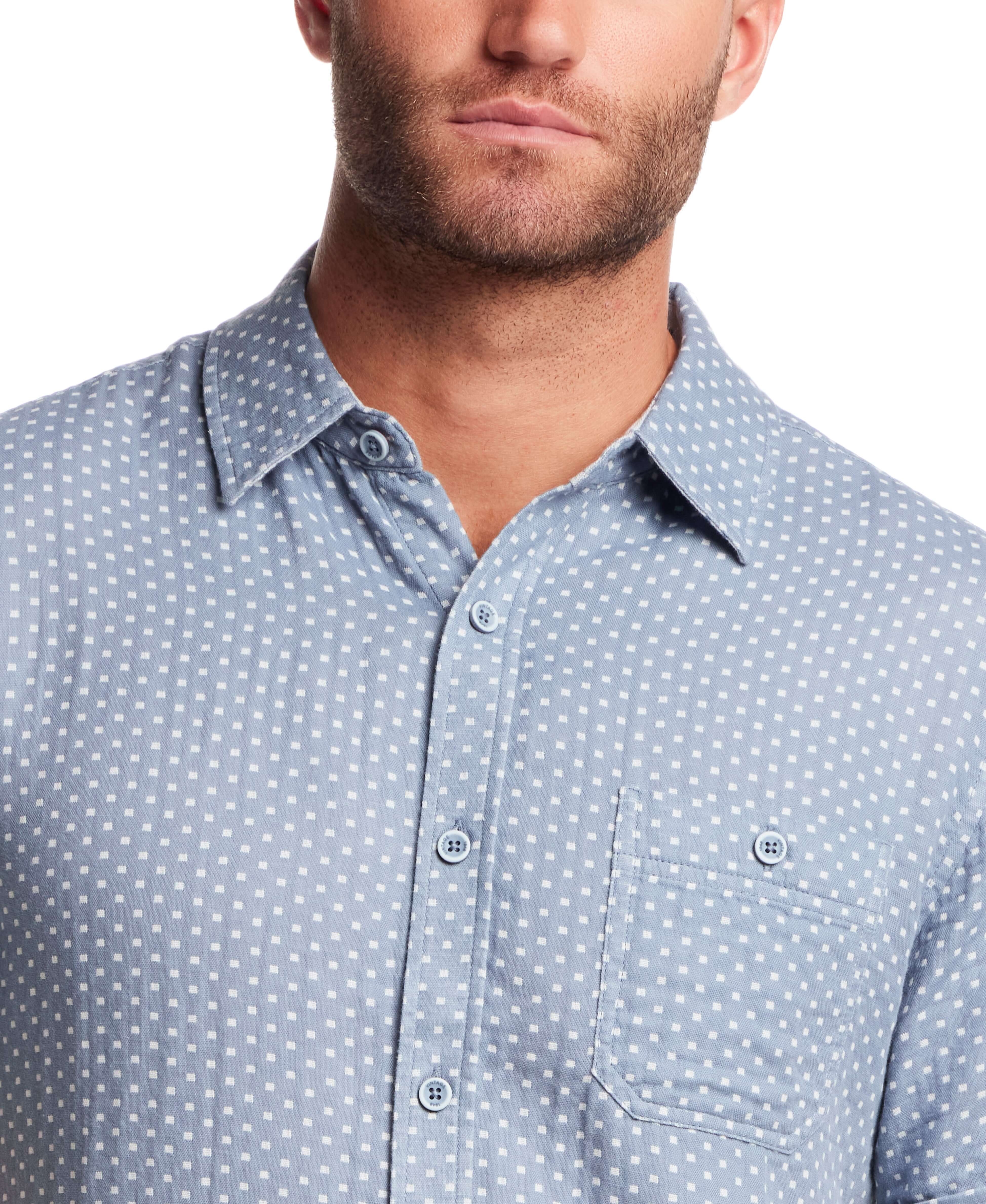 Double Layer Dobby Short Sleeve Shirt in Dusty Blue close-up view showcasing the textured pattern and button closure.