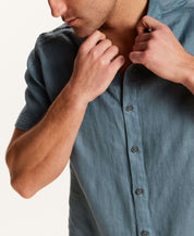 Short-Sleeve Linen Shirt in Blue featuring a refined slate blue color and relaxed fit.