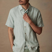 Short Sleeve Linen Shirt in Teal Mist worn by a model, featuring a relaxed fit and a single chest pocket.