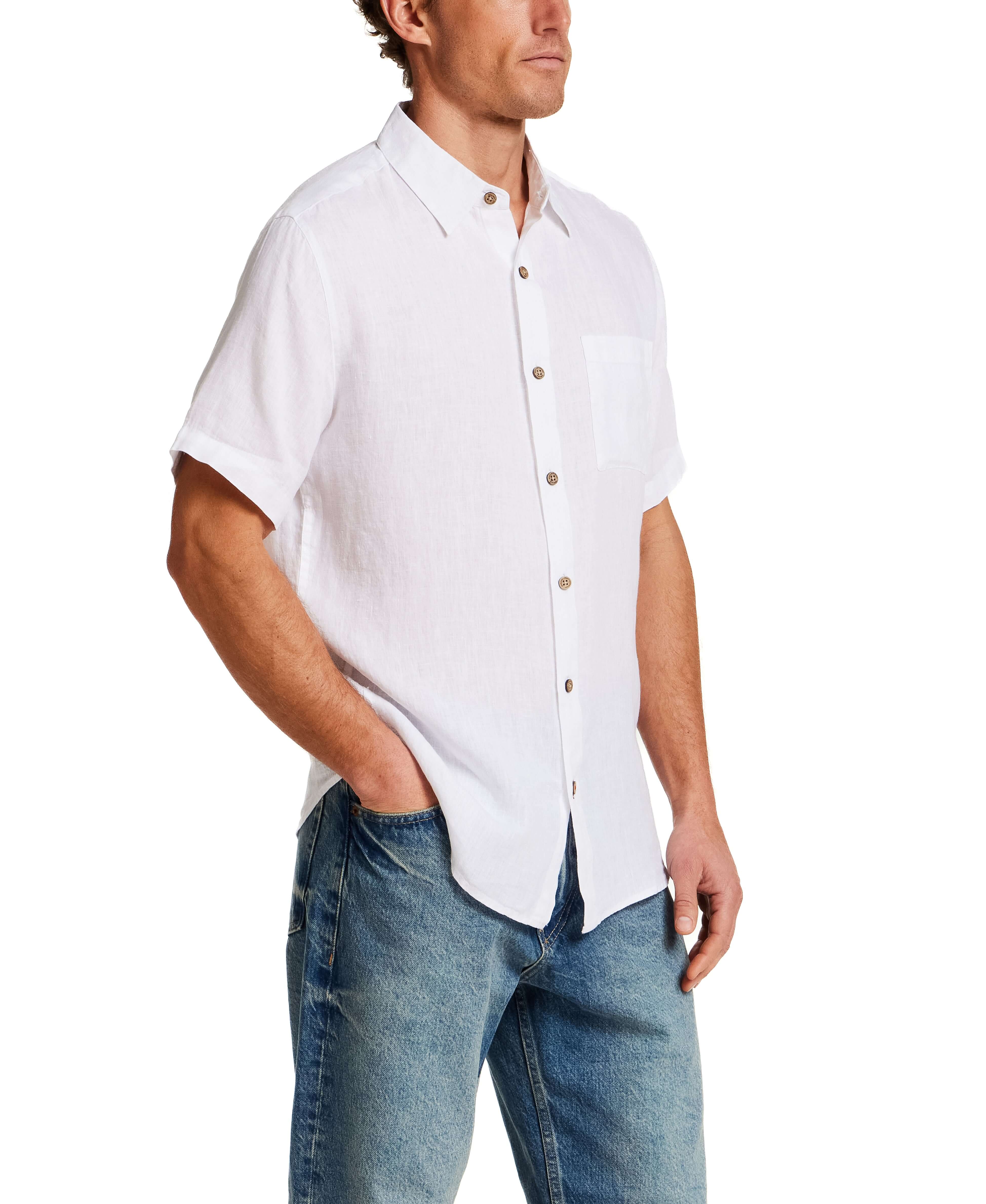 Short Sleeve Linen Shirt in White on model, featuring a chest pocket and button closure, made of 100% linen.