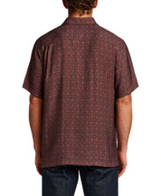 Back view of a model wearing the Petal Print Short-Sleeve Shirt showcasing its subtle all-over petal texture.