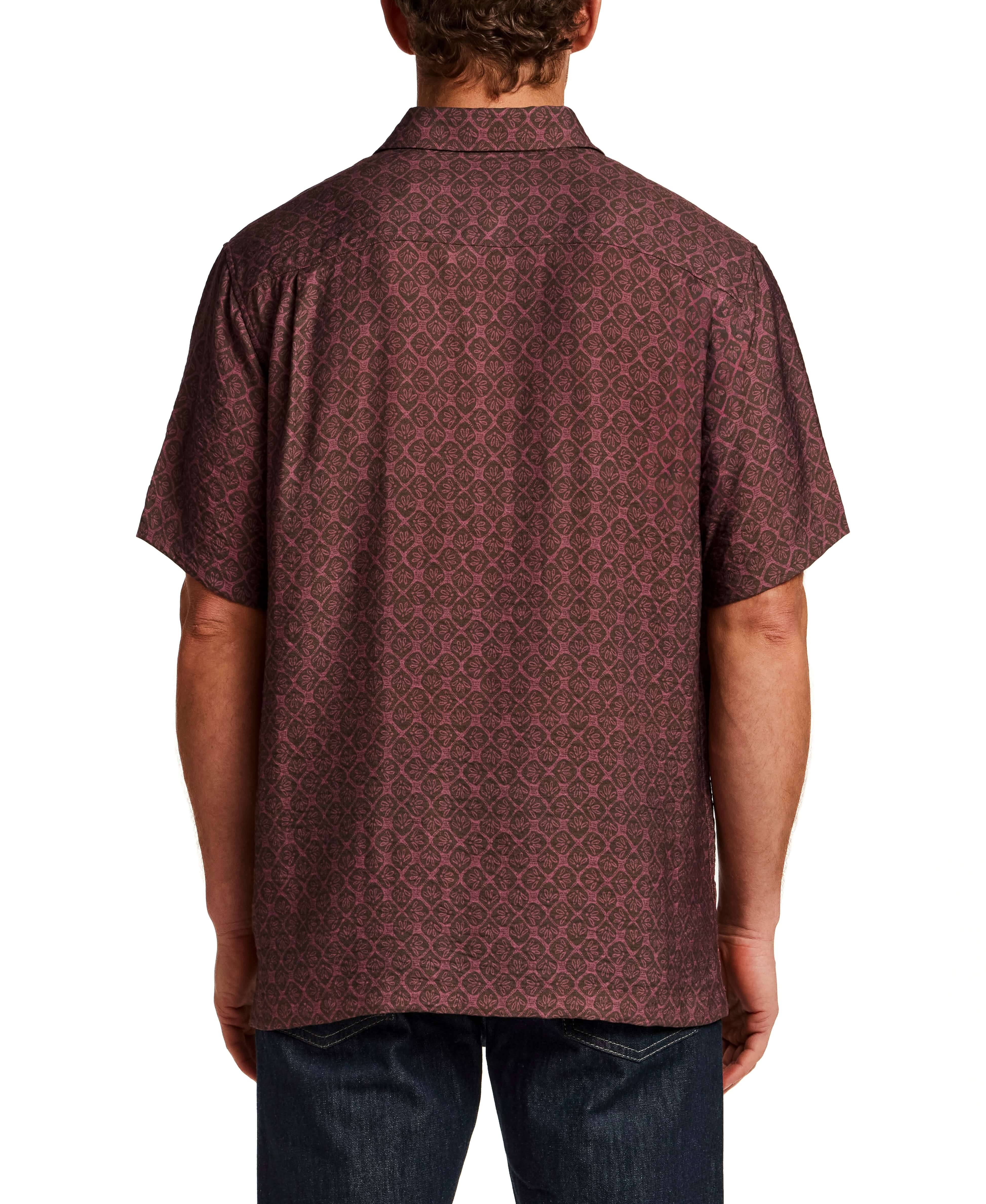 Back view of a model wearing the Petal Print Short-Sleeve Shirt showcasing its subtle all-over petal texture.