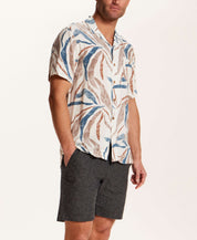 Short Sleeve Rayon Printed Camp Shirt in Marsala worn with dark shorts, showcasing a retro pattern and camp collar style.