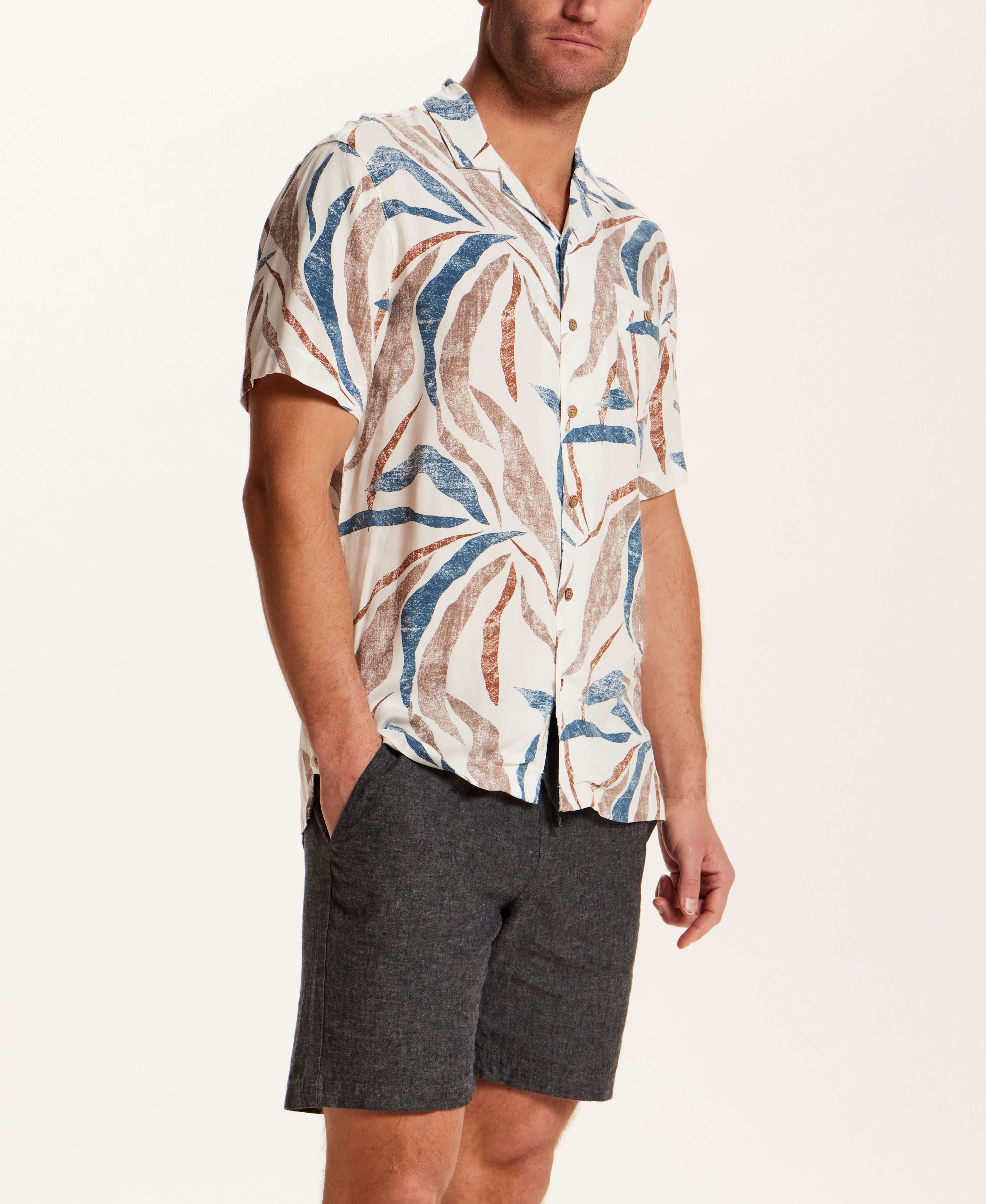 Short Sleeve Rayon Printed Camp Shirt in Marsala worn with dark shorts, showcasing a retro pattern and camp collar style.