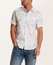 Model wearing a Short Sleeve Seersucker Stripe in English Manor shirt, with a breathable cotton design and allover print.