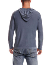Back view of a man wearing the Stonewash Hooded Sweater in Insignia Blue, featuring a relaxed fit and soft fabric.