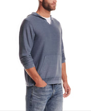 Stonewash Hooded Sweater in Insignia Blue worn by a man, featuring relaxed fit and kangaroo pocket.