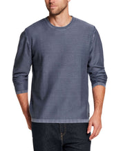 Twill Stonewash Sweater in Insignia Blue worn by a man, showcasing its soft cotton yarn and classic roll-neck design.