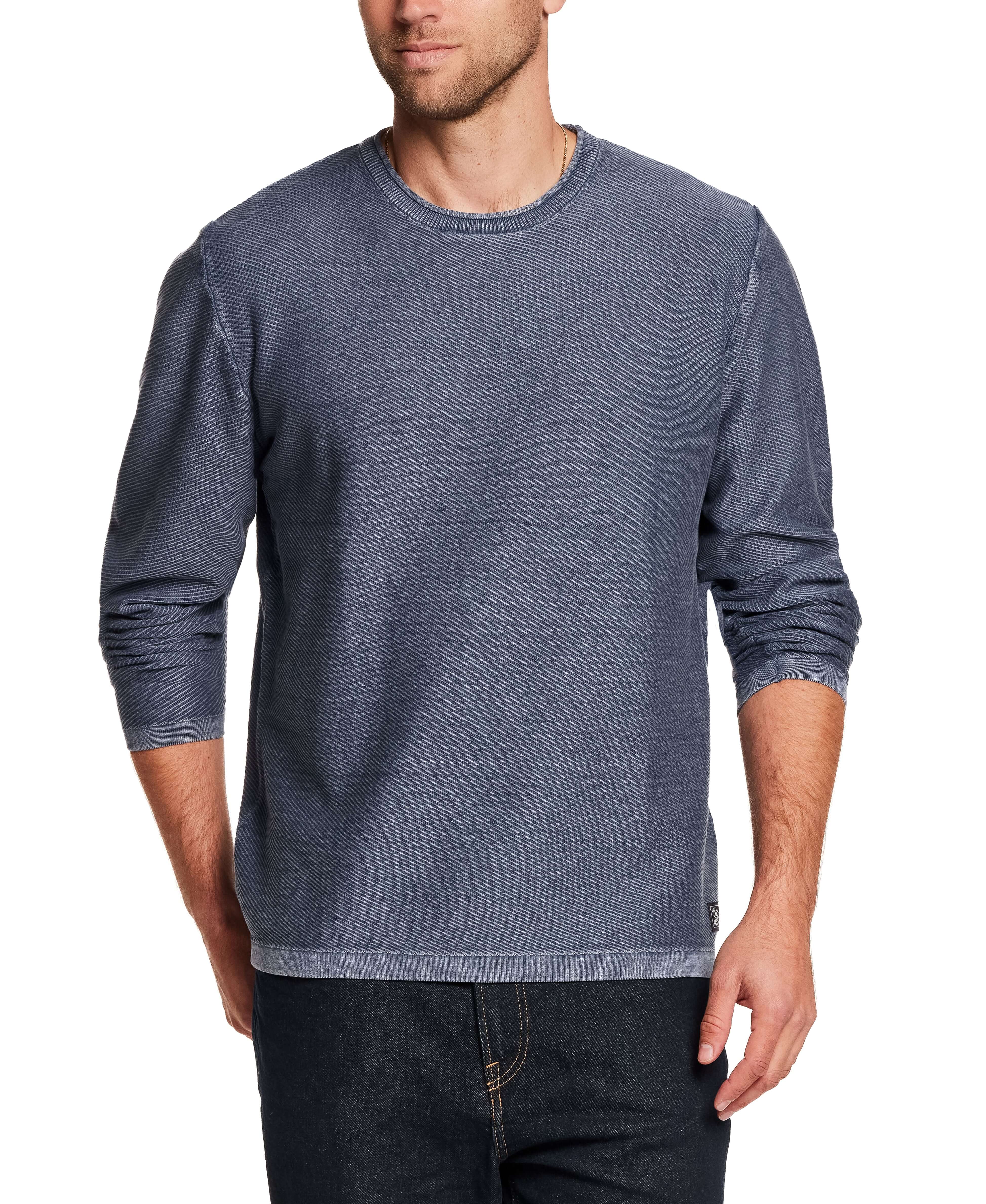 Twill Stonewash Sweater in Insignia Blue worn by a man, showcasing its soft cotton yarn and classic roll-neck design.