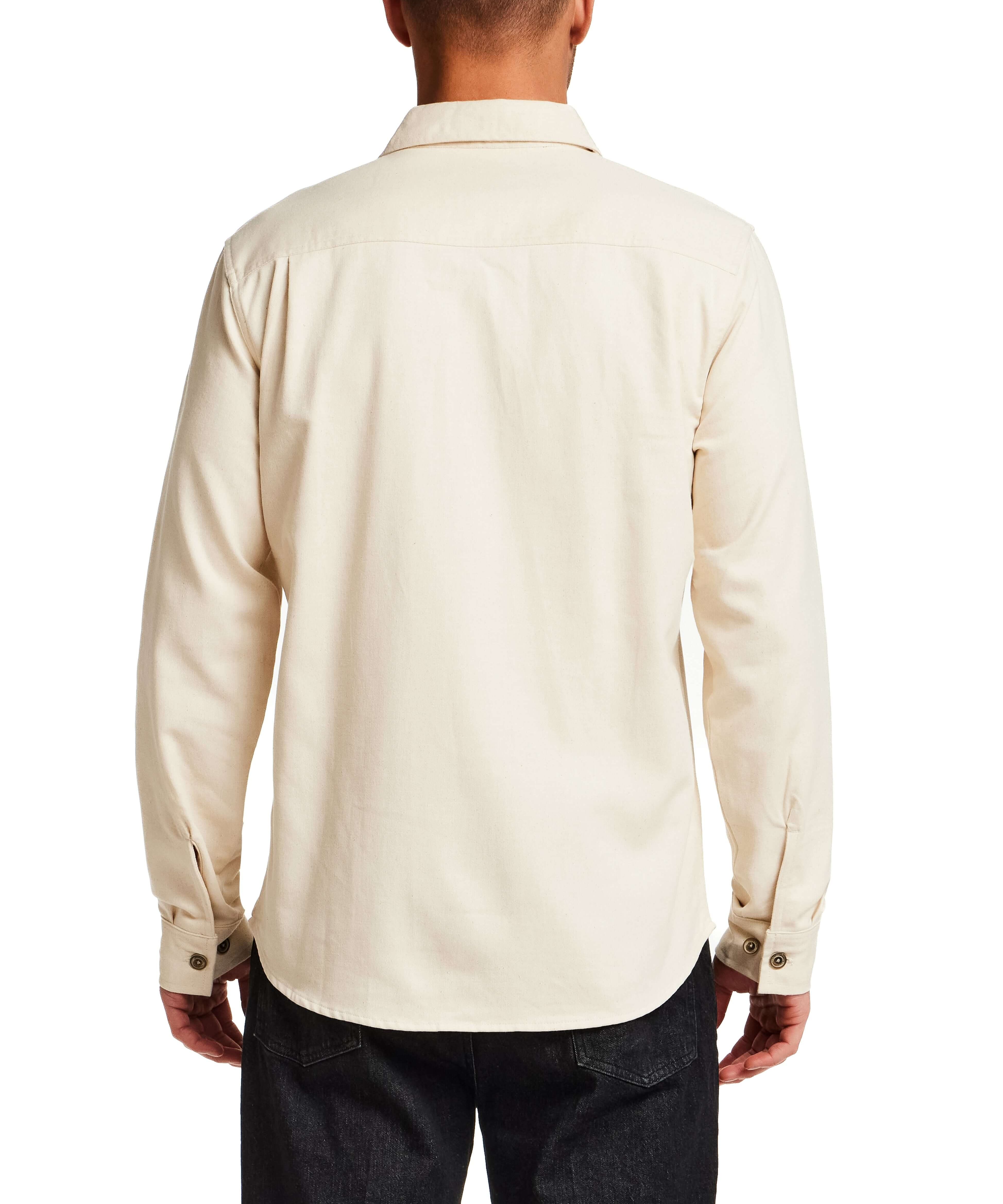 Back view of The Utility Shirt in Natural, showcasing its classic design and button detailing.