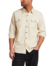 Model wearing The Utility Shirt in Natural with button front and flap chest pockets.