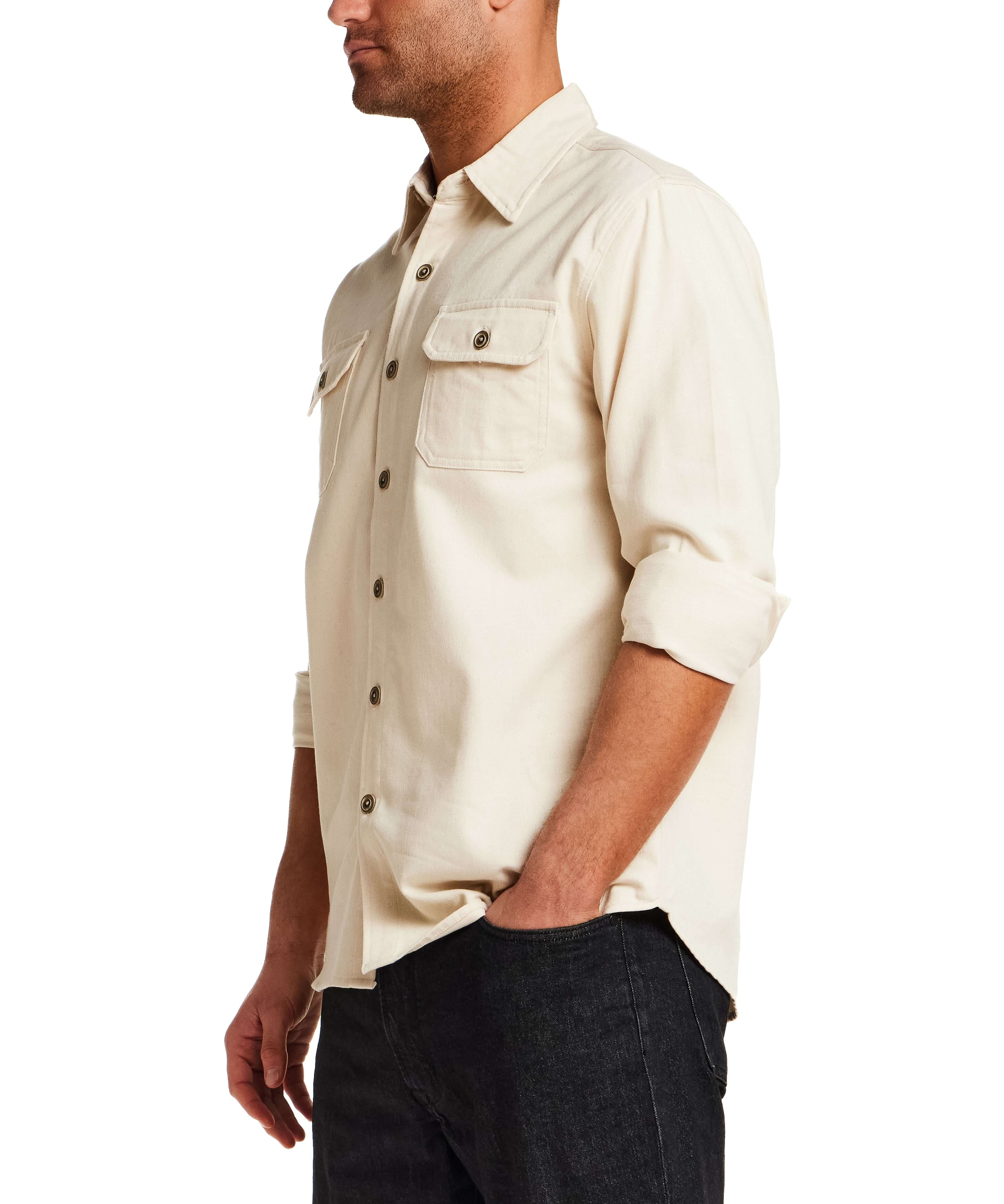 The Utility Shirt in Natural worn by a model, showcasing a button front and flap chest pockets.