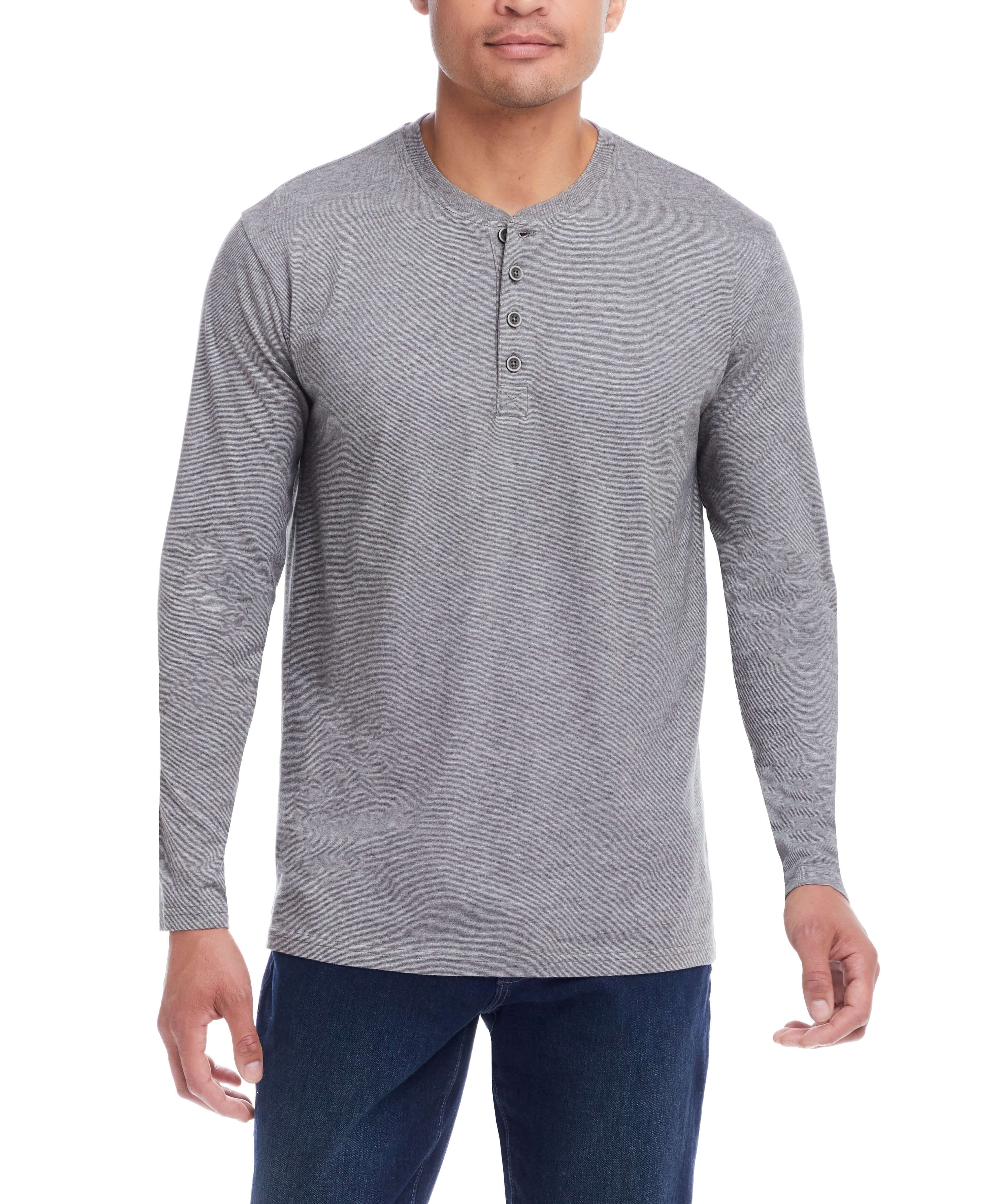 Man wearing a Microstripe Henley in Deep Depths, featuring vintage buttons and side slits for a modern casual look.