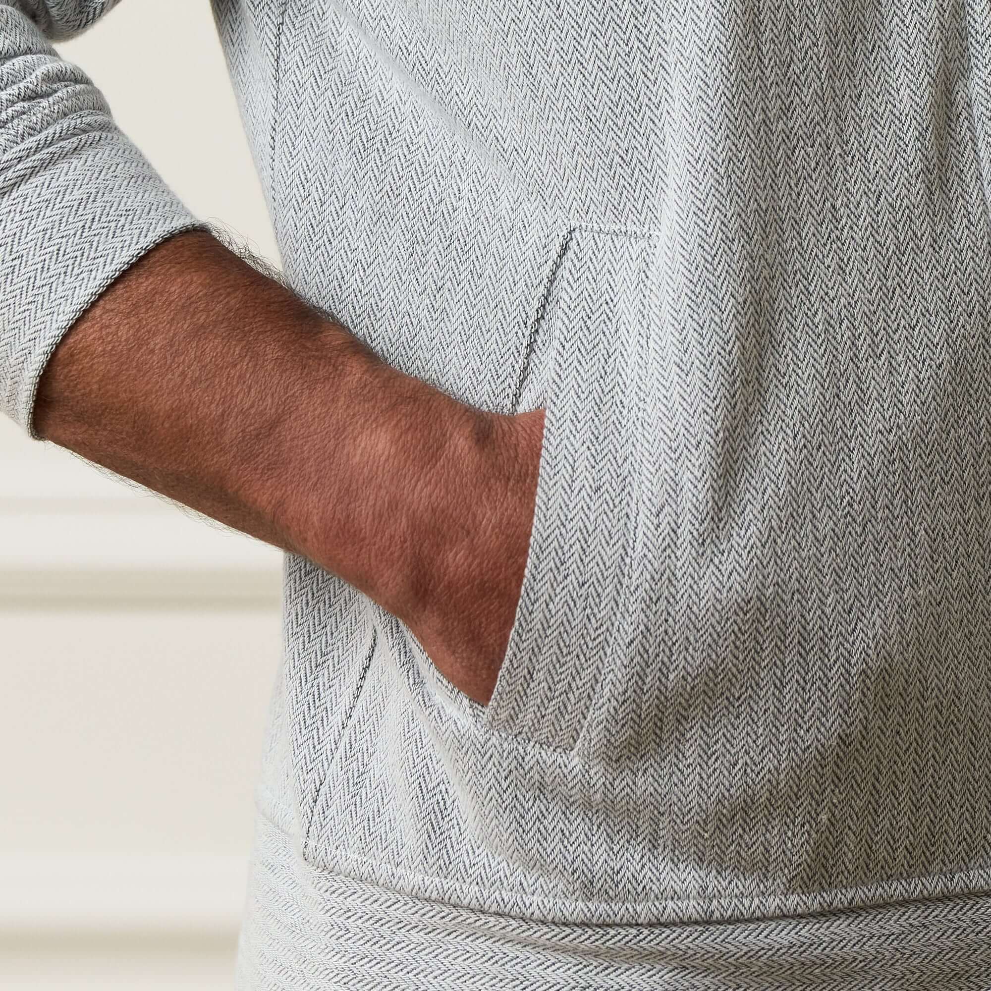 Mini Herringbone Bomber Jacket in Natural showcasing the fabric texture and pocket detail.