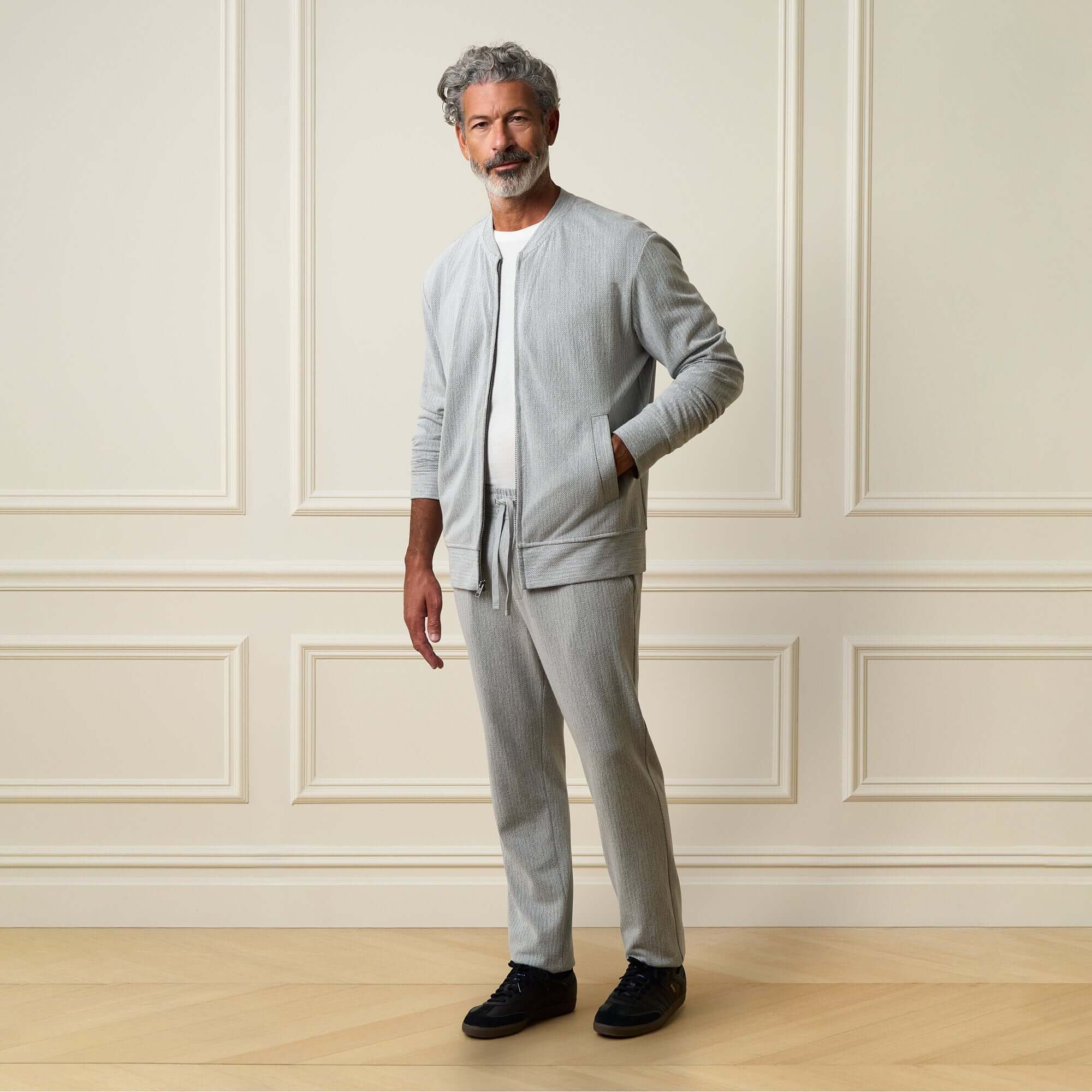 Mini Herringbone Drawstring Pant in Natural paired with matching bomber jacket, modeled by a man in a stylish setting.