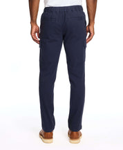Men's navy cargo pants with stretch waist and side pockets, showcasing a comfortable fit from the back.