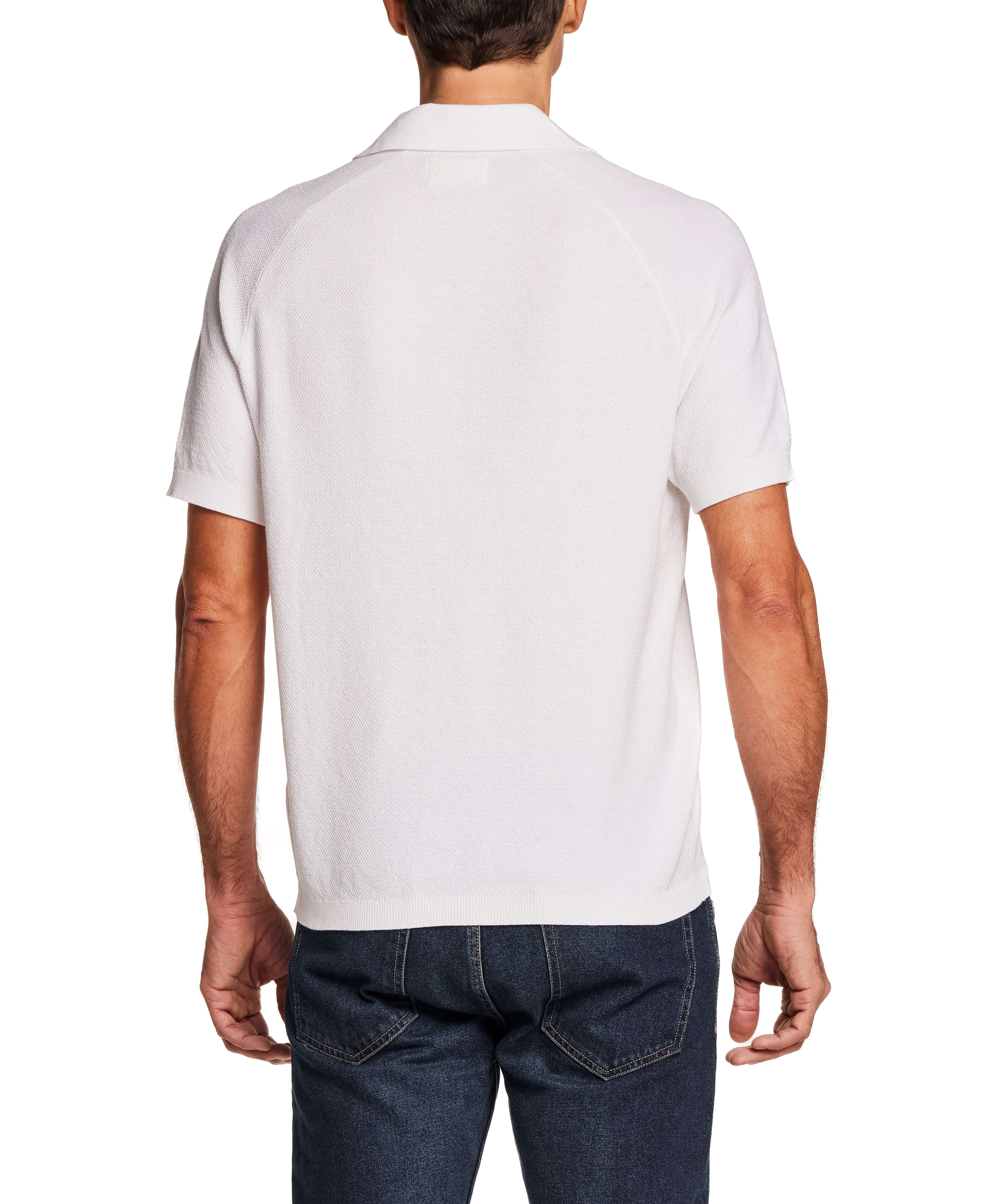 Back view of the Open Collar Polo Sweater in Bleached White, showcasing its relaxed fit and stylish design.
