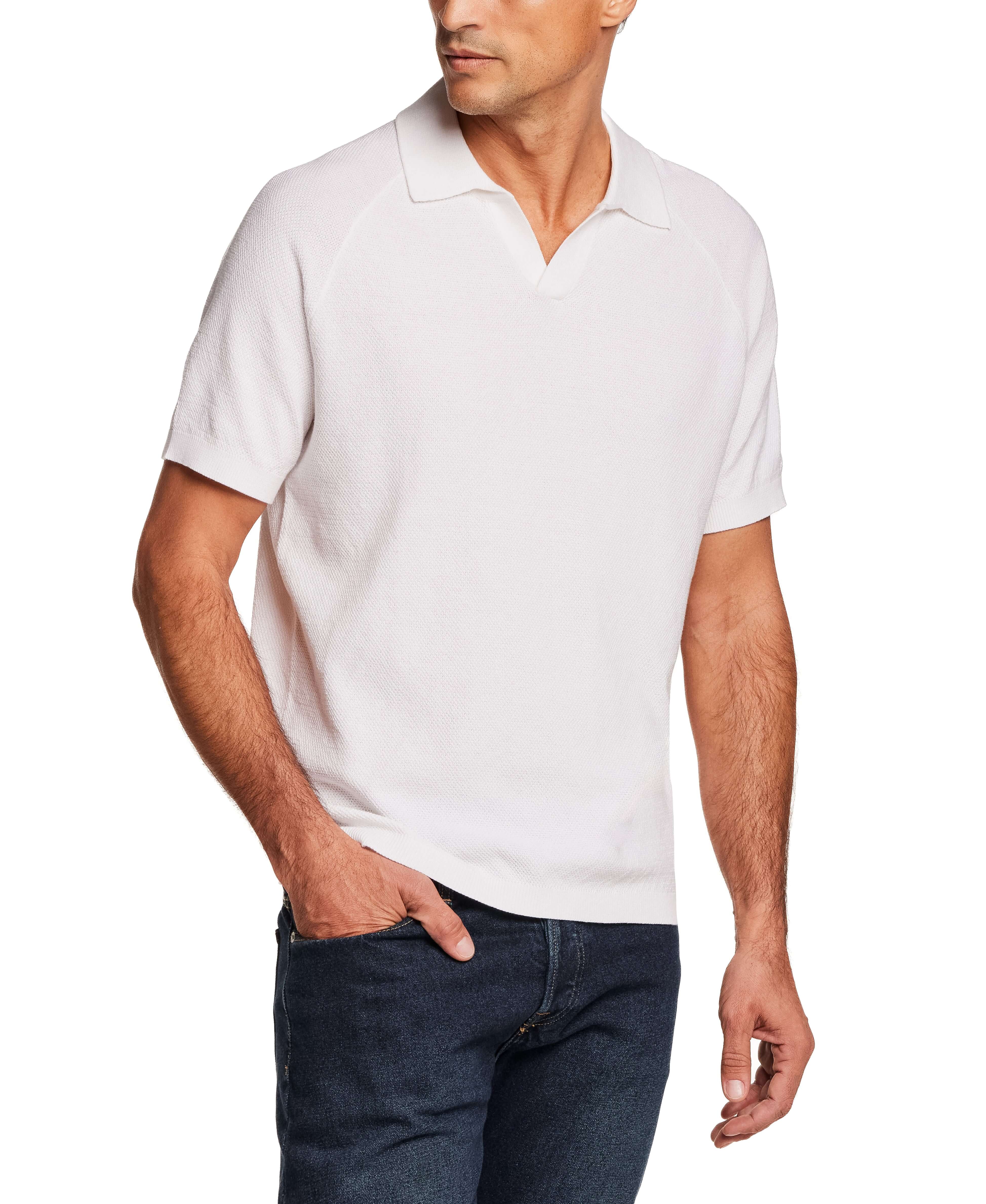 Open Collar Polo Sweater in Bleached White worn by a model with a confident pose.