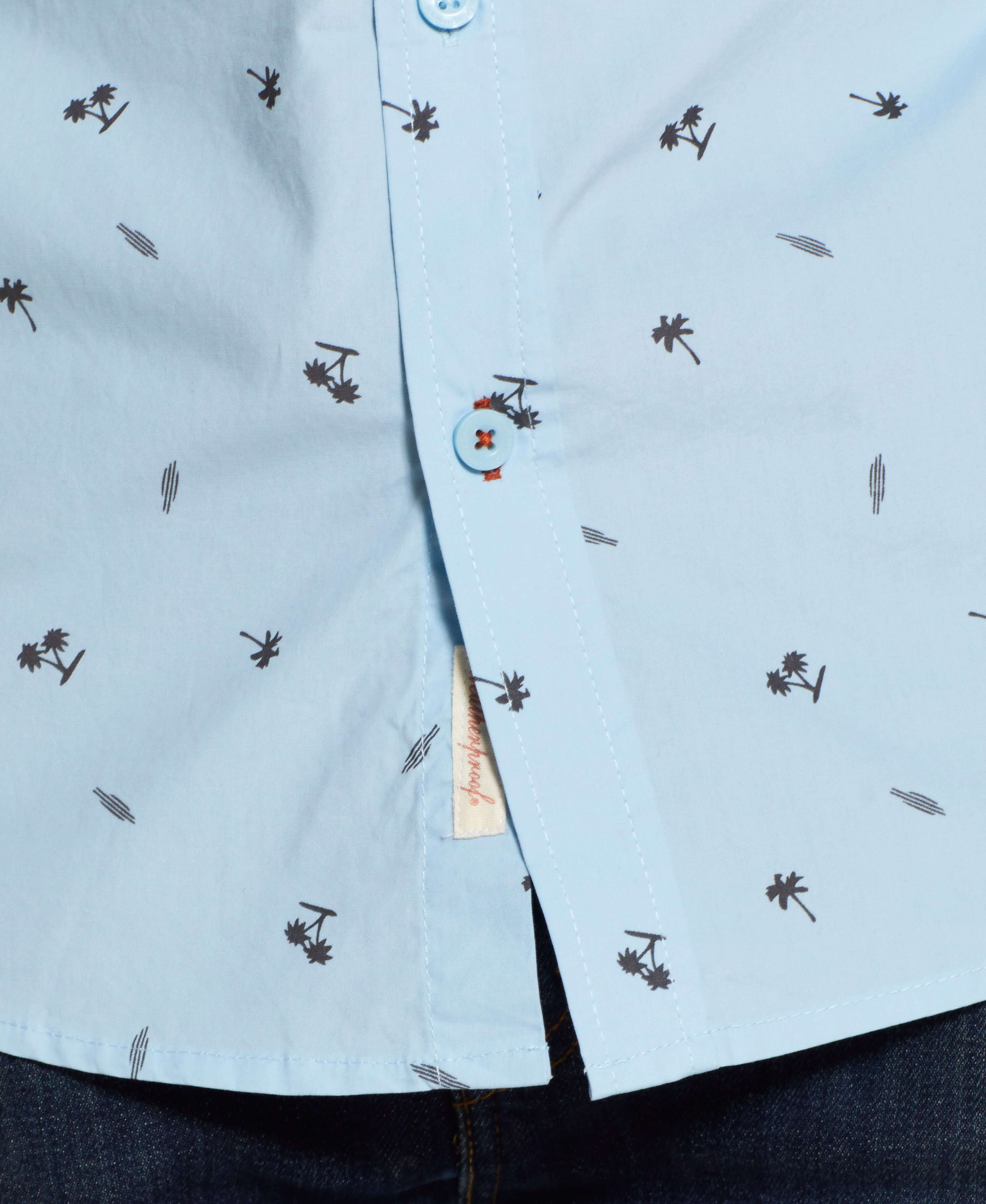 Peached Poplin Mini Print In Soft Blue shirt featuring palm tree print and front button detail.