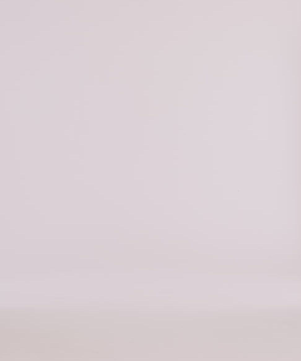 Minimalistic backdrop for product photography featuring soft, neutral tones, ideal for showcasing apparel.