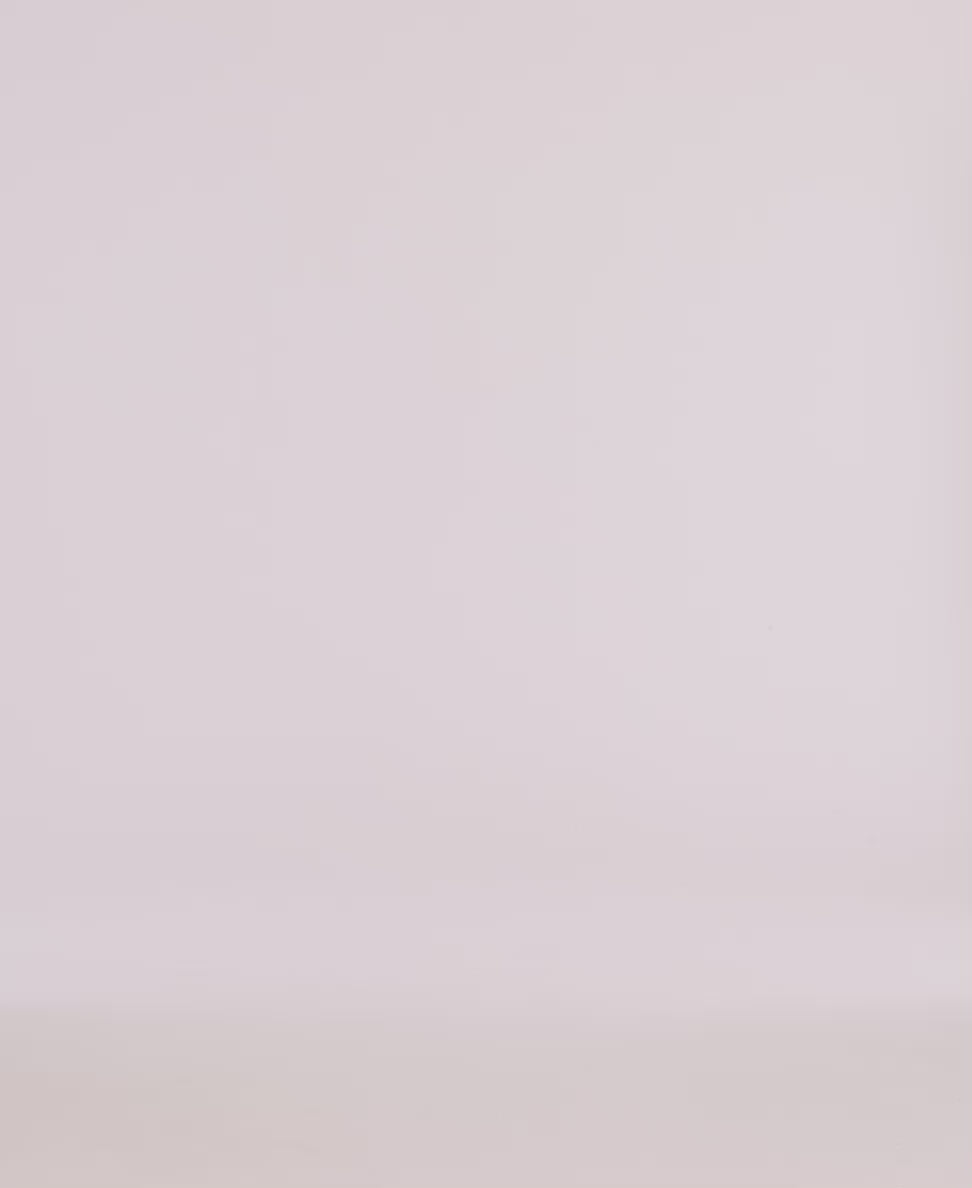 Minimalistic backdrop for product photography featuring soft, neutral tones, ideal for showcasing apparel.