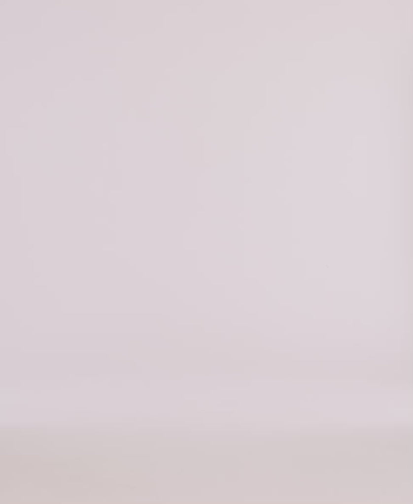 Minimalistic backdrop for product photography featuring soft, neutral tones, ideal for showcasing apparel.