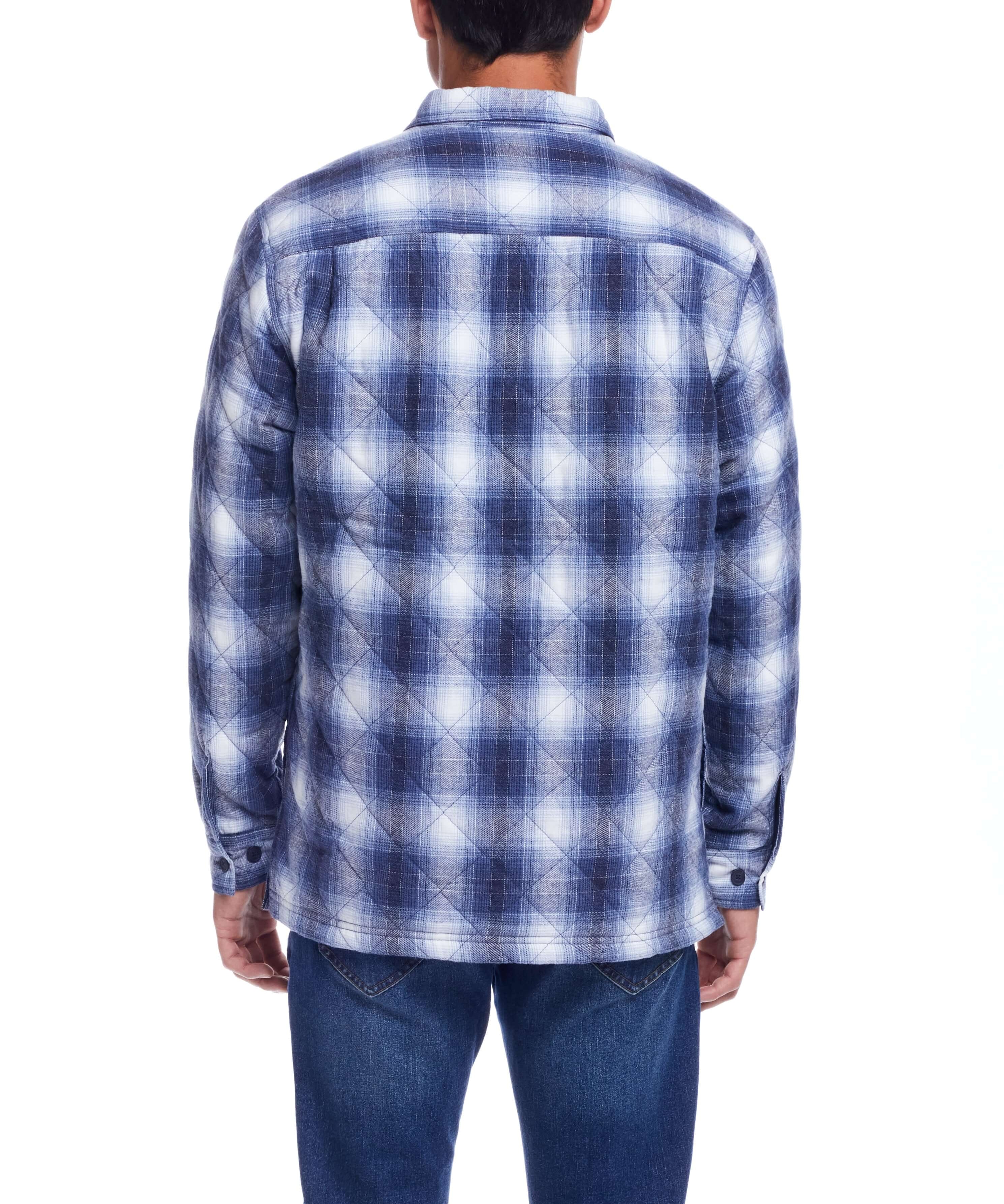 Back view of a man wearing a quilted plaid shirt jacket in blue tones, perfect for winter fashion.