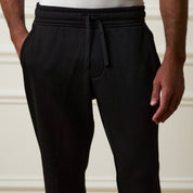 Ribbed Drawstring Pant in Black featuring a comfortable drawstring waistband and a stylish ribbed texture.