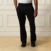Ribbed Drawstring Pant in Black worn by a model, featuring a comfortable drawstring waist and straight leg design.