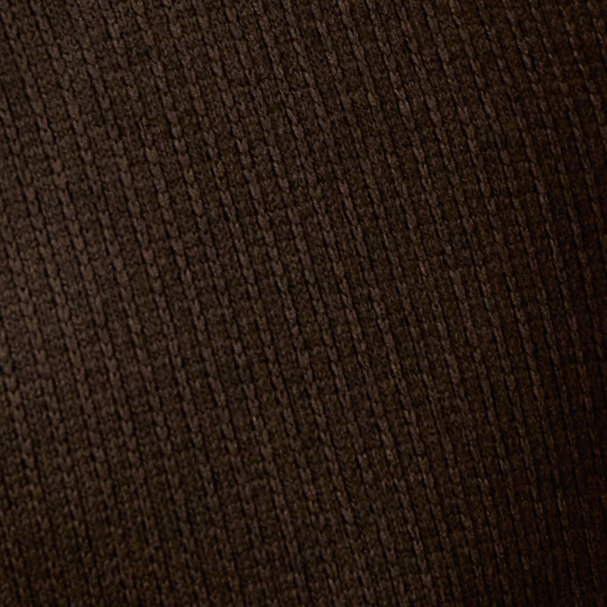Close-up of ribbed texture in a rich brown hue, showcasing the soft fabric of the Ribbed Quarter Zip in Brown.