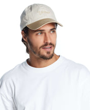 Model wearing a khaki adjustable Script Vintage Hat, featuring a relaxed fit and stylish embroidery.