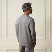 Man shown from the back wearing the Scuba Crew Neck in Grey, showcasing its modern design and structured fabric.