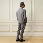 Scuba Crew Neck in Grey worn by a model from the back, showcasing smooth scuba knit fabric and modern design.