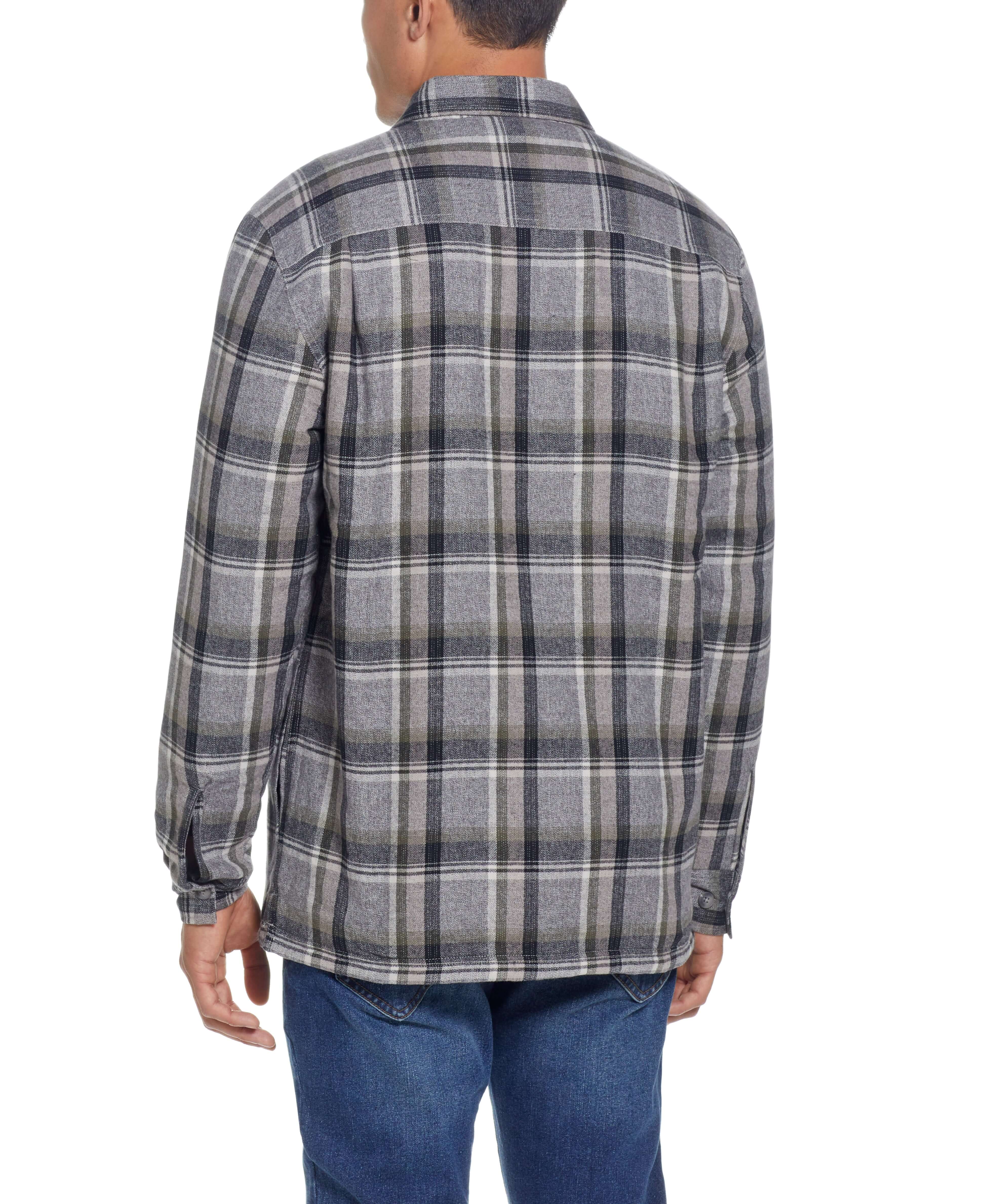 Back view of a man wearing a twine sherpa lined flannel shirt jacket, featuring a classic plaid pattern and relaxed fit.