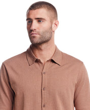 Short sleeve button front knit coat in biscuit color with mini jacquard checkerboard pattern on model.