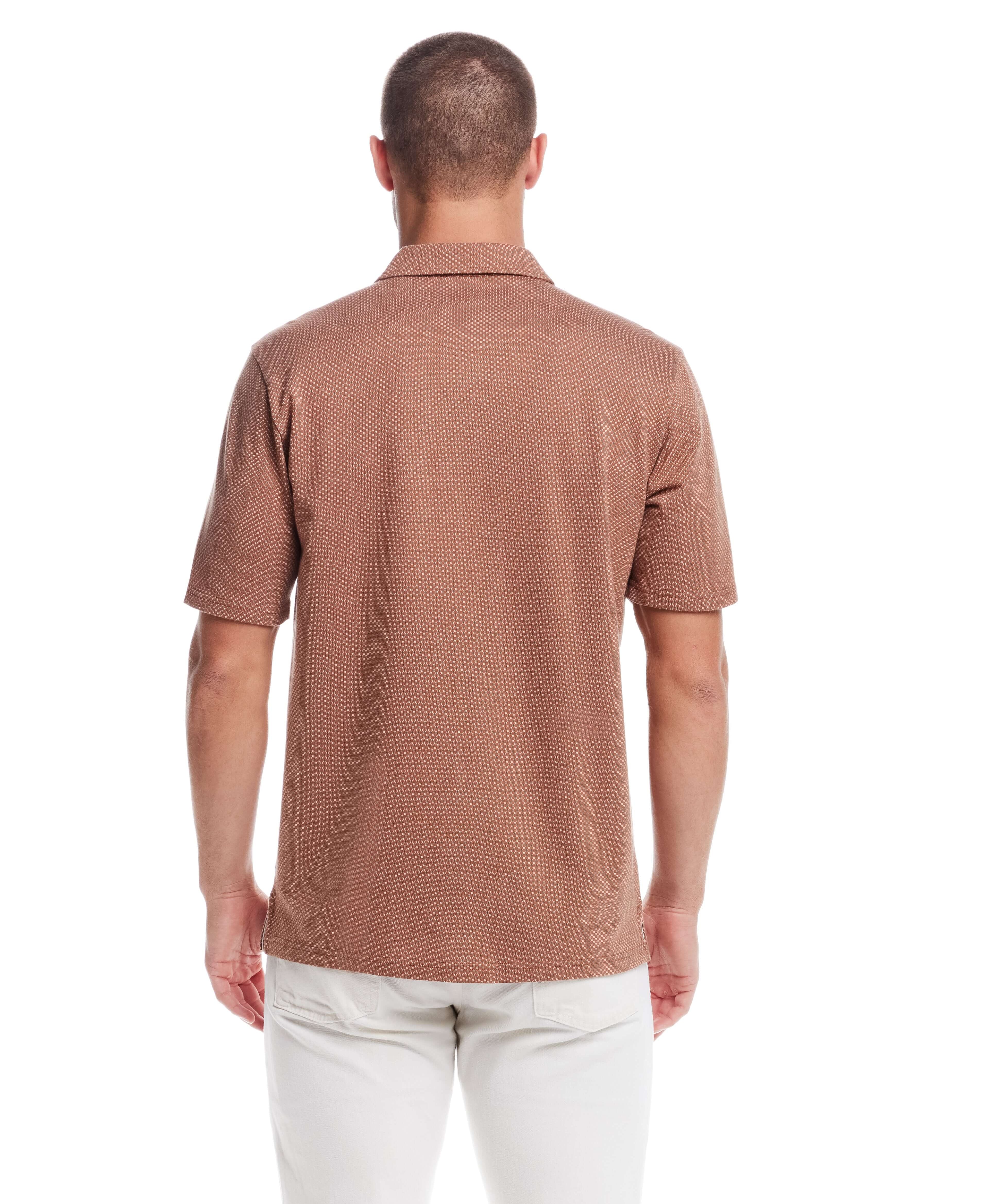 Back view of a man in a short sleeve, button front coat in biscuit color, showcasing its jacquard checkerboard pattern.
