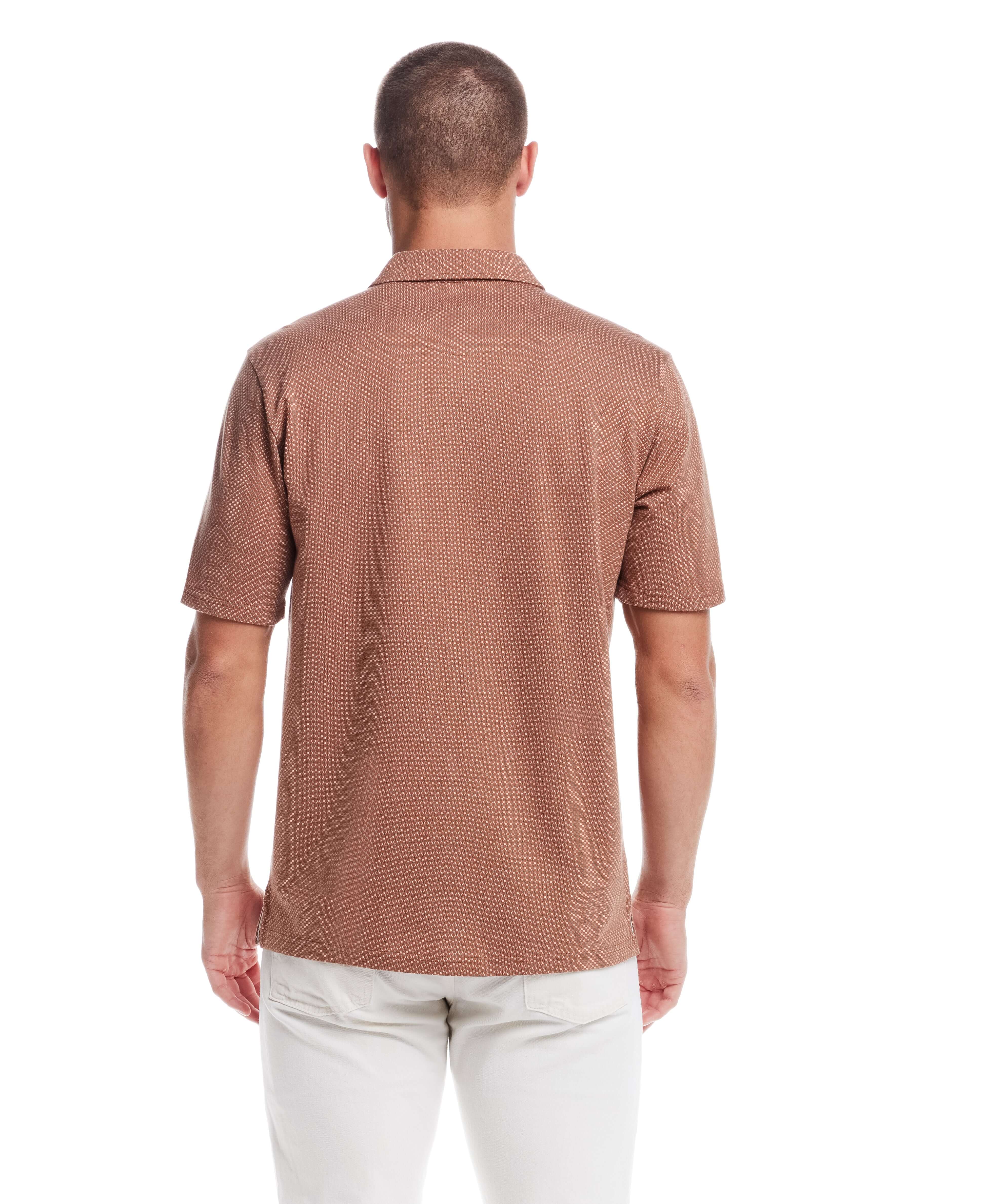 Back view of a man in a short sleeve, button front coat in biscuit color, showcasing its jacquard checkerboard pattern.