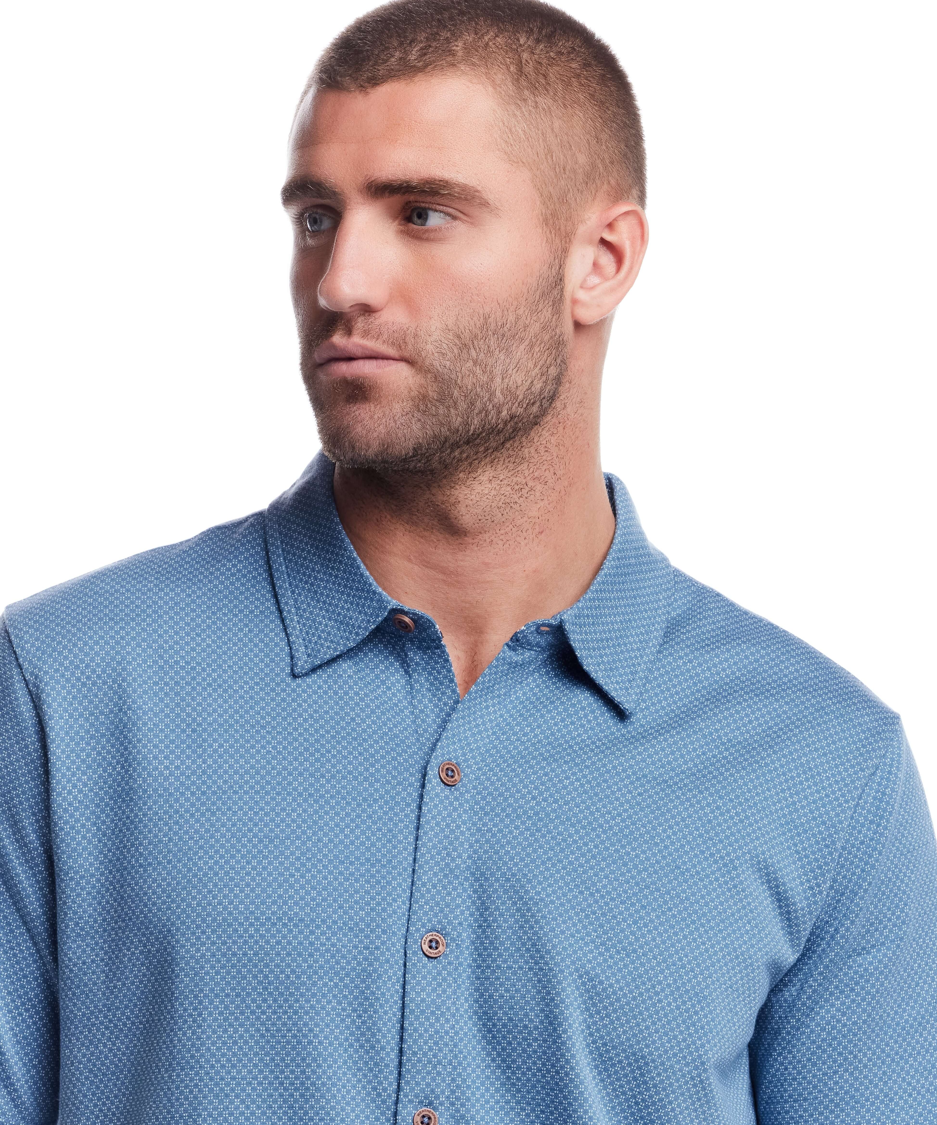Model wearing a blue short sleeve coat front knit tee with a checkerboard pattern, showcasing its soft cotton fabric.