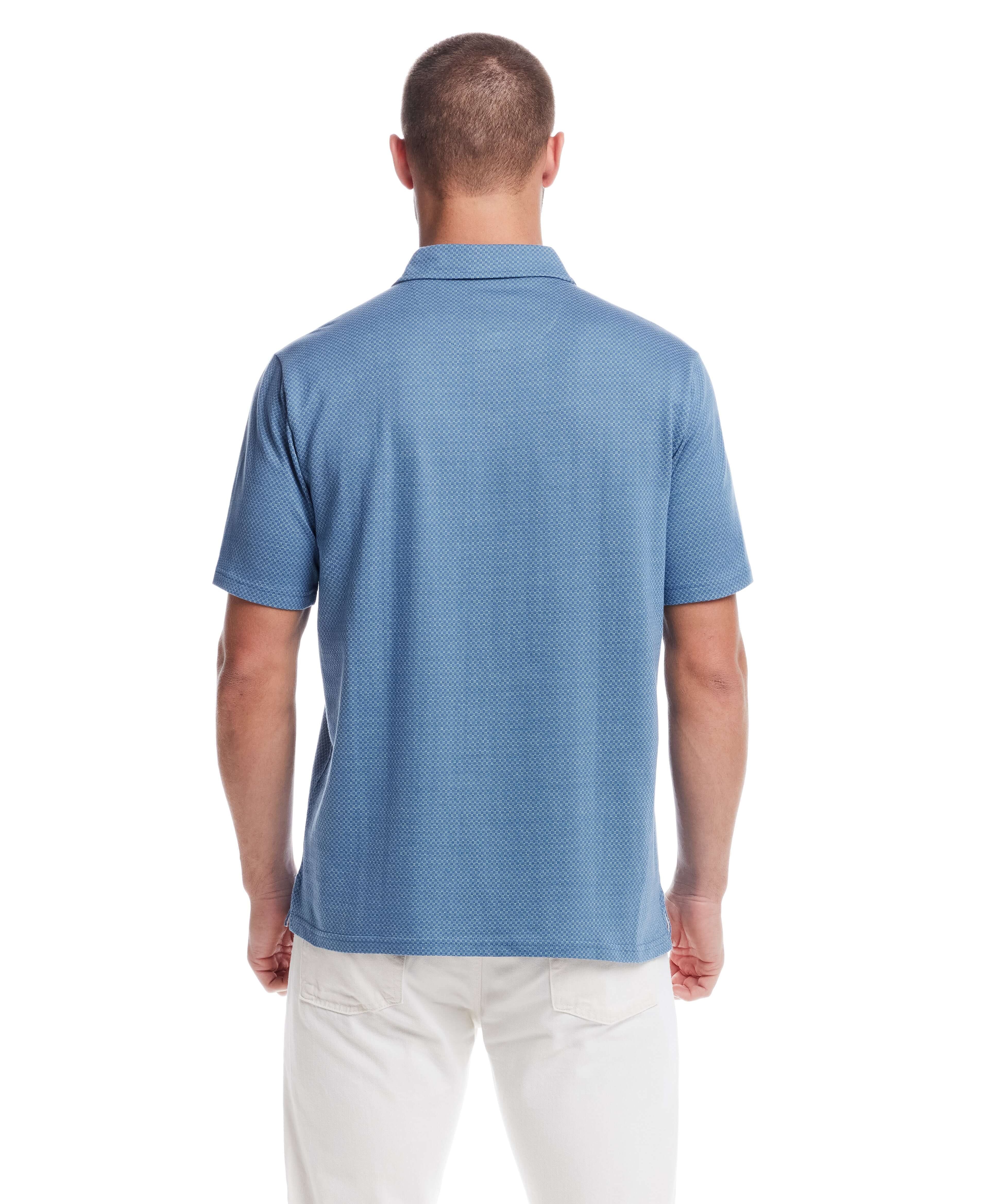Back view of a man wearing a blue short sleeve coat with a mini jacquard checkerboard pattern.