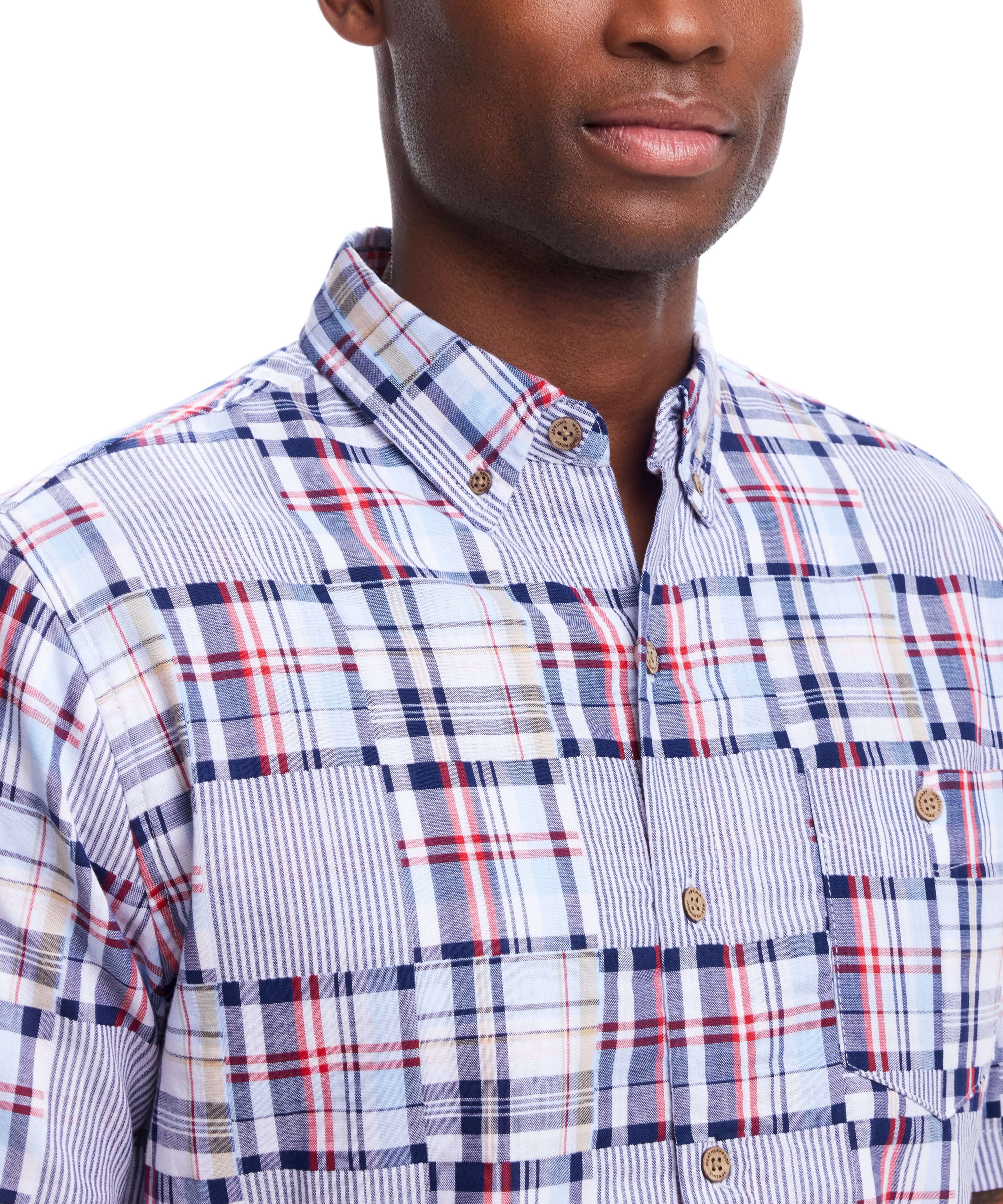 Close-up of a model wearing a Short Sleeve Cotton Patchwork Shirt In Icelandic Blue with a unique patchwork print.