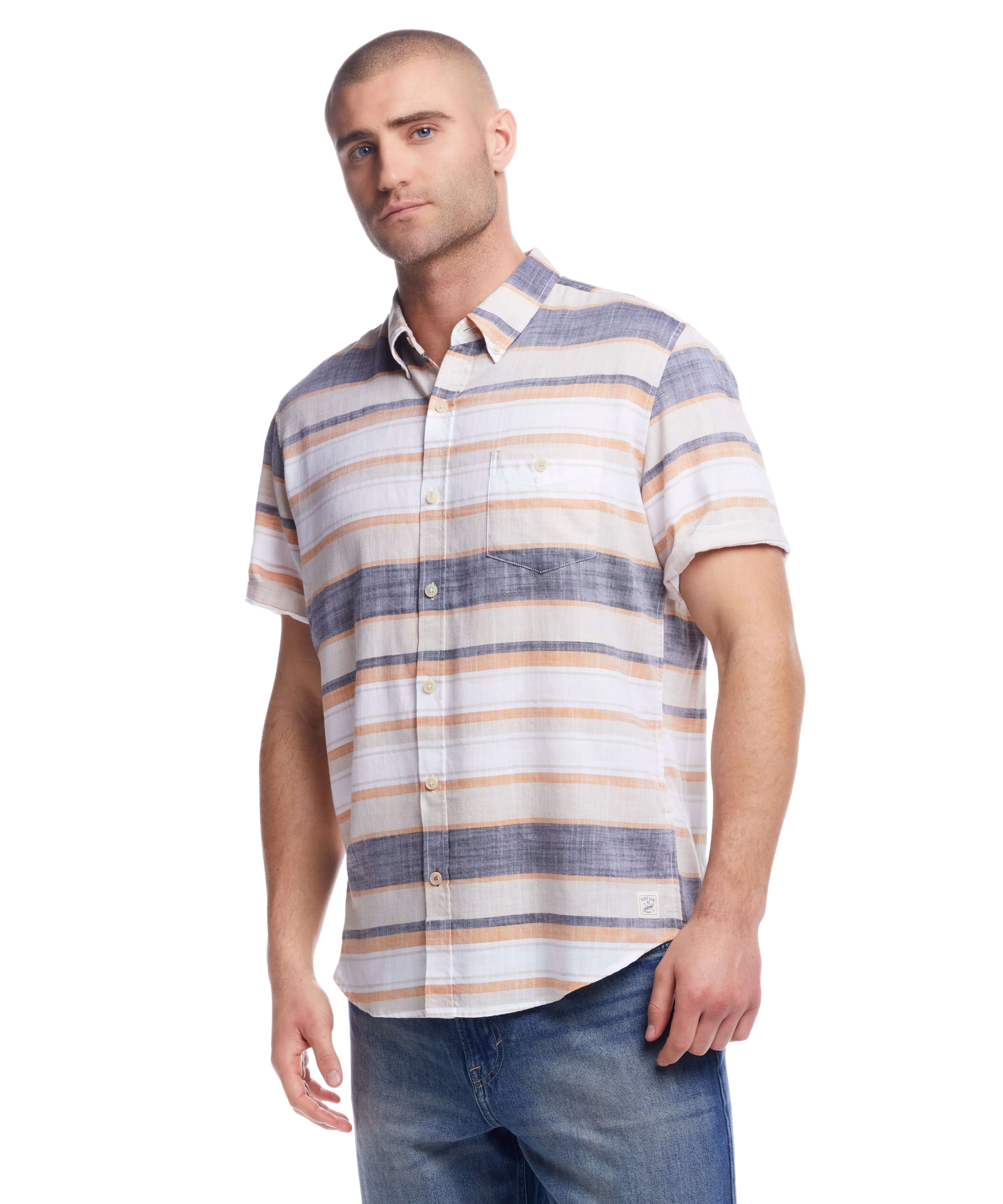 Short sleeve twill stripe shirt in wheat with button-down collar, model wearing large size, classic fit.
