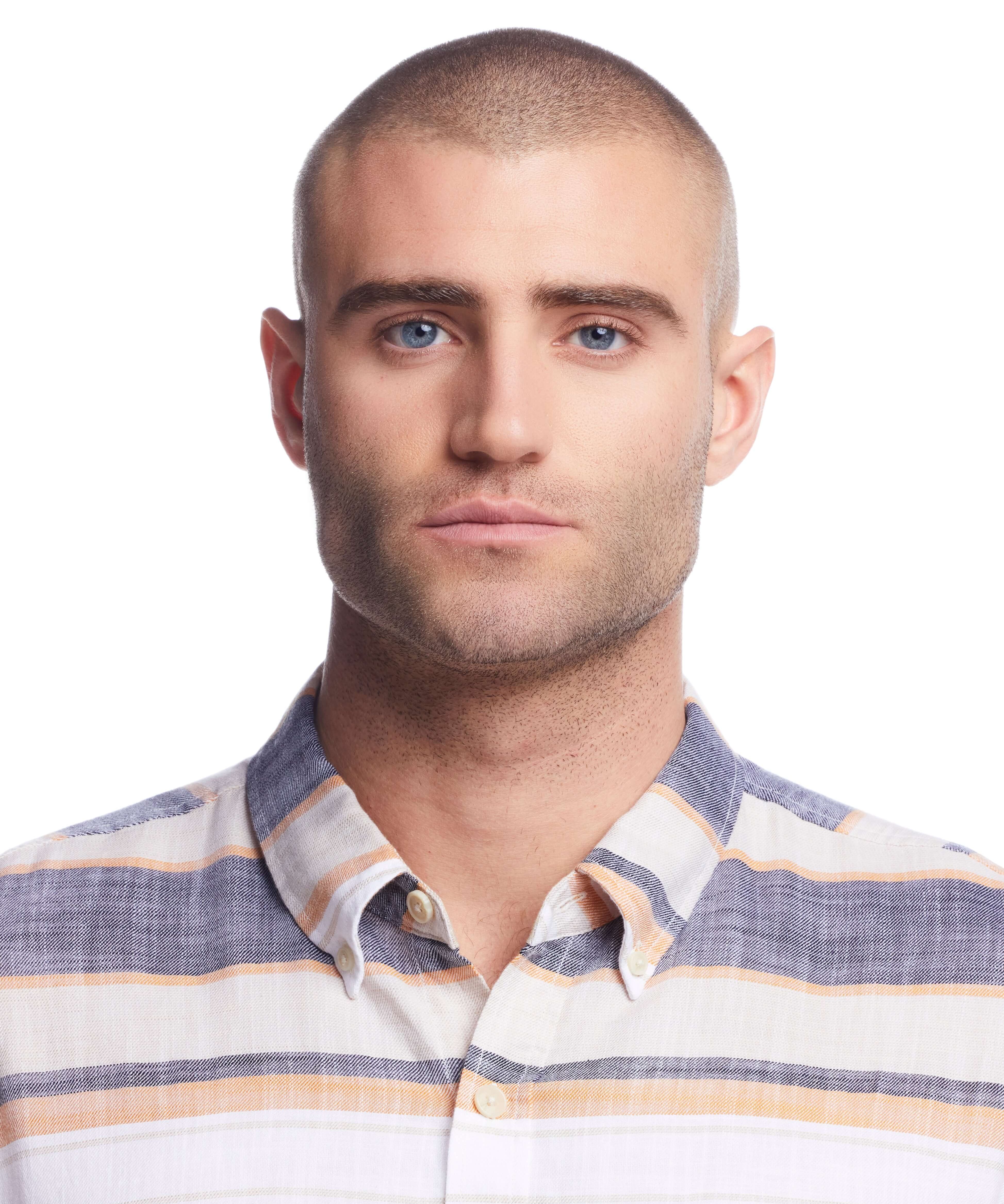Model wearing a Short Sleeve Country Twill Stripe Shirt in Wheat, featuring cuffed sleeves and a button-down collar.