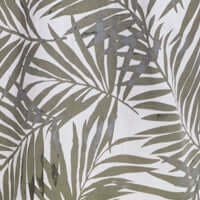 Close-up of green leaf pattern fabric, ideal for a breezy floral shirt, featuring tropical palm leaves on a light background.