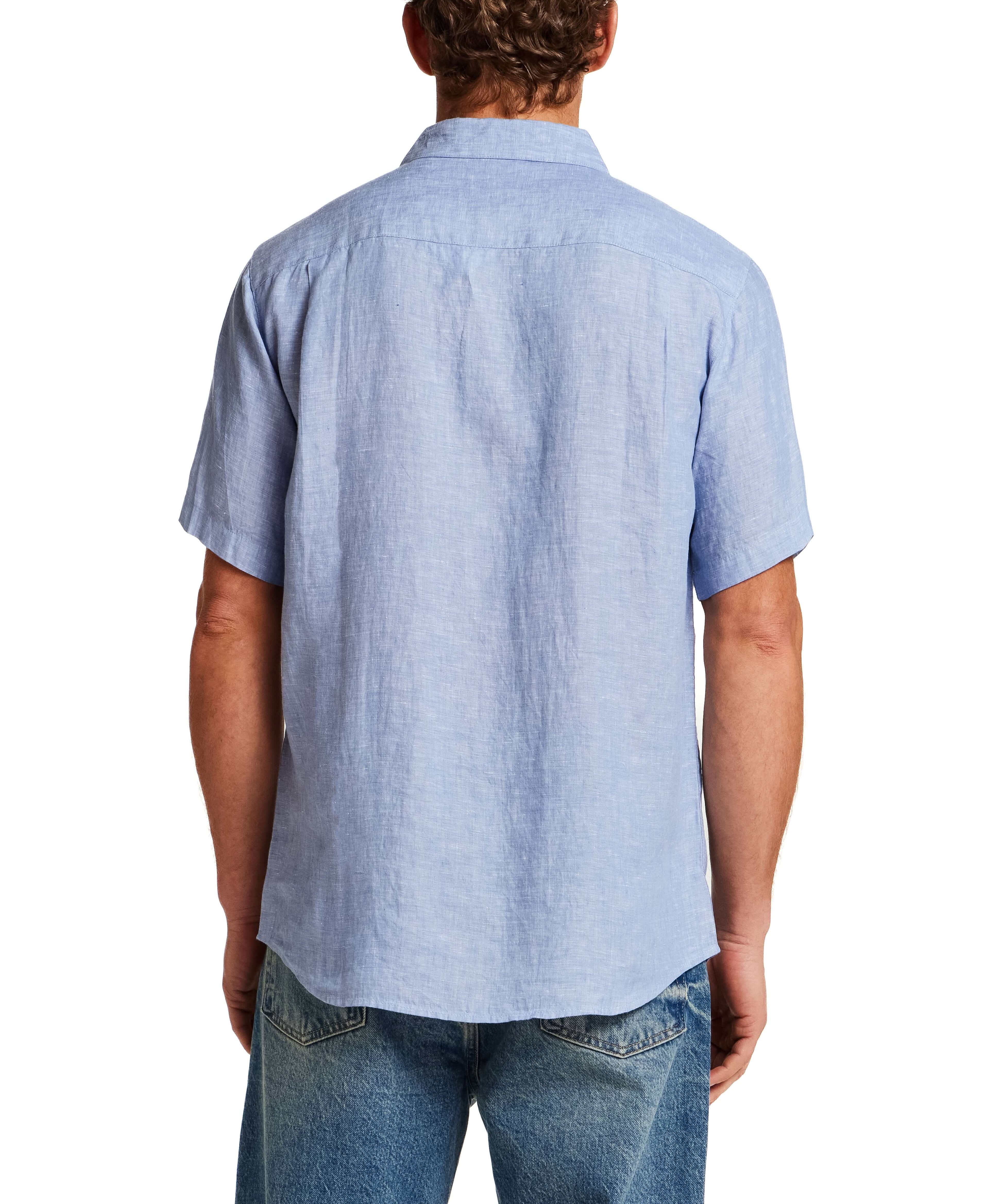 Back view of a man wearing a Short Sleeve Linen Shirt in Infinity Blue, showcasing its classic fit and linen fabric.